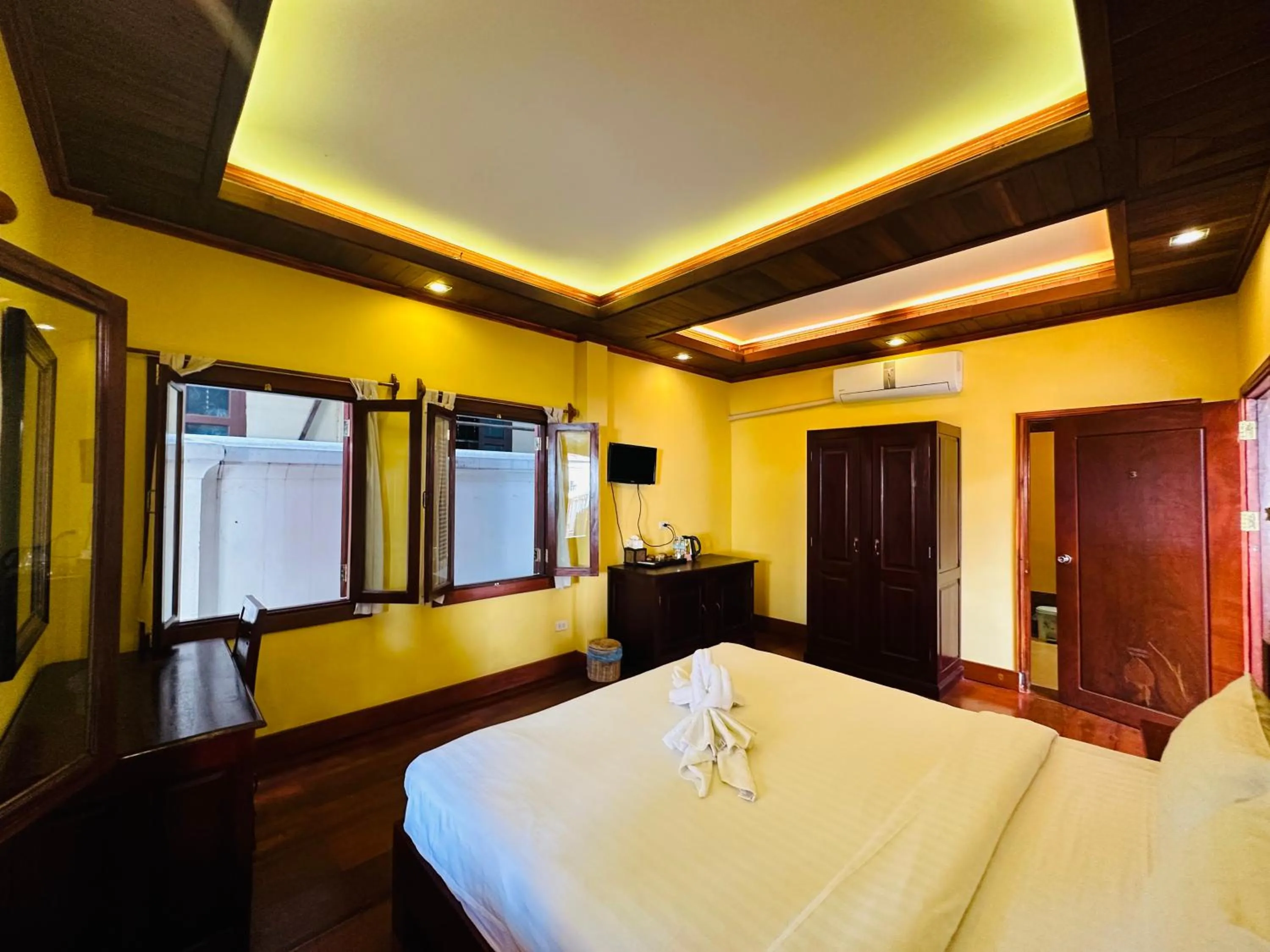 Bed in Villa Phonethip Mekong Riverside