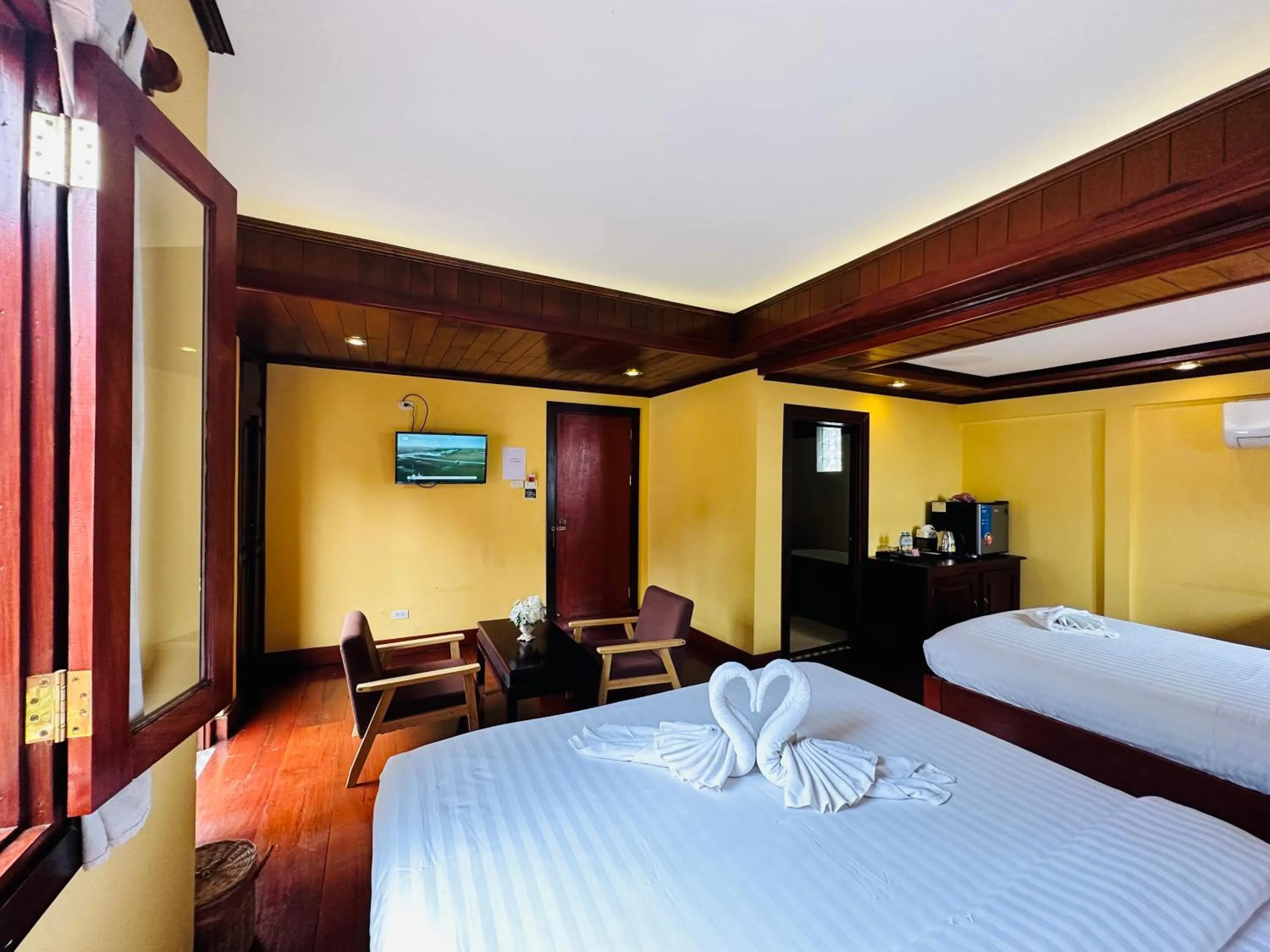 Bed in Villa Phonethip Mekong Riverside