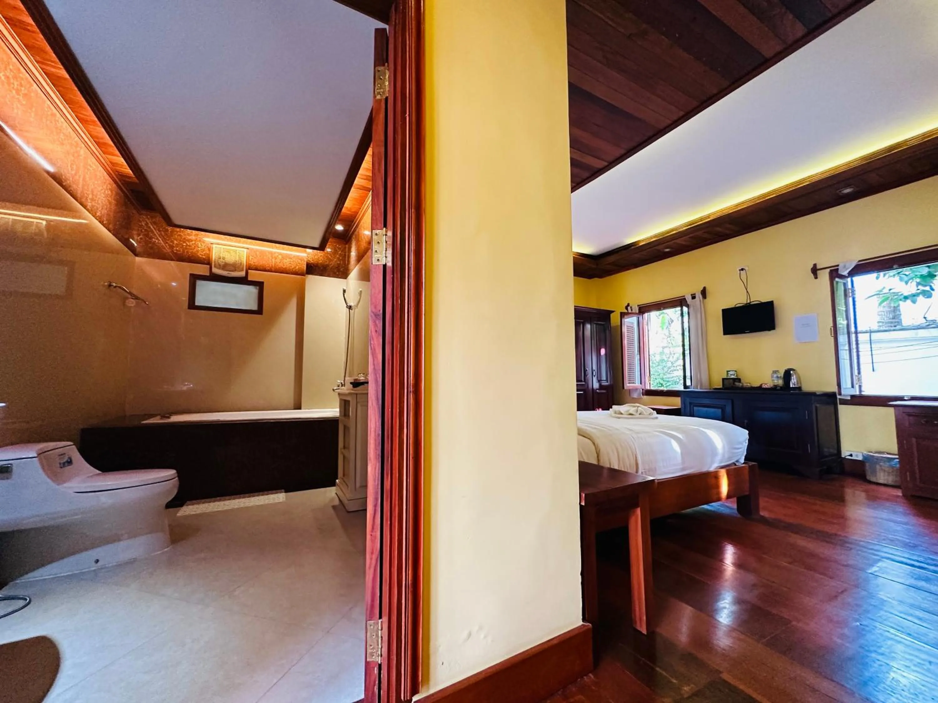 Bed in Villa Phonethip Mekong Riverside