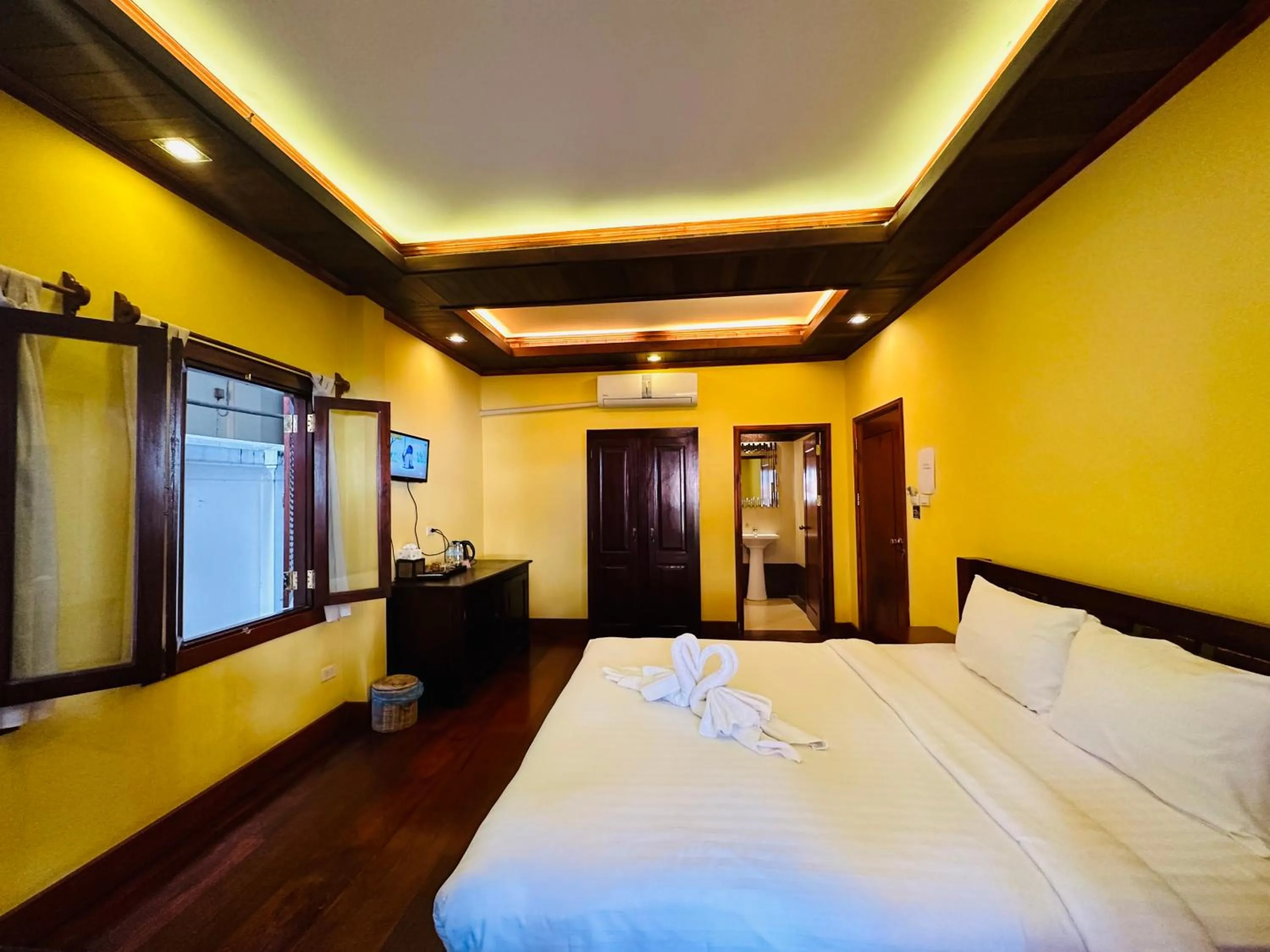 Bed in Villa Phonethip Mekong Riverside