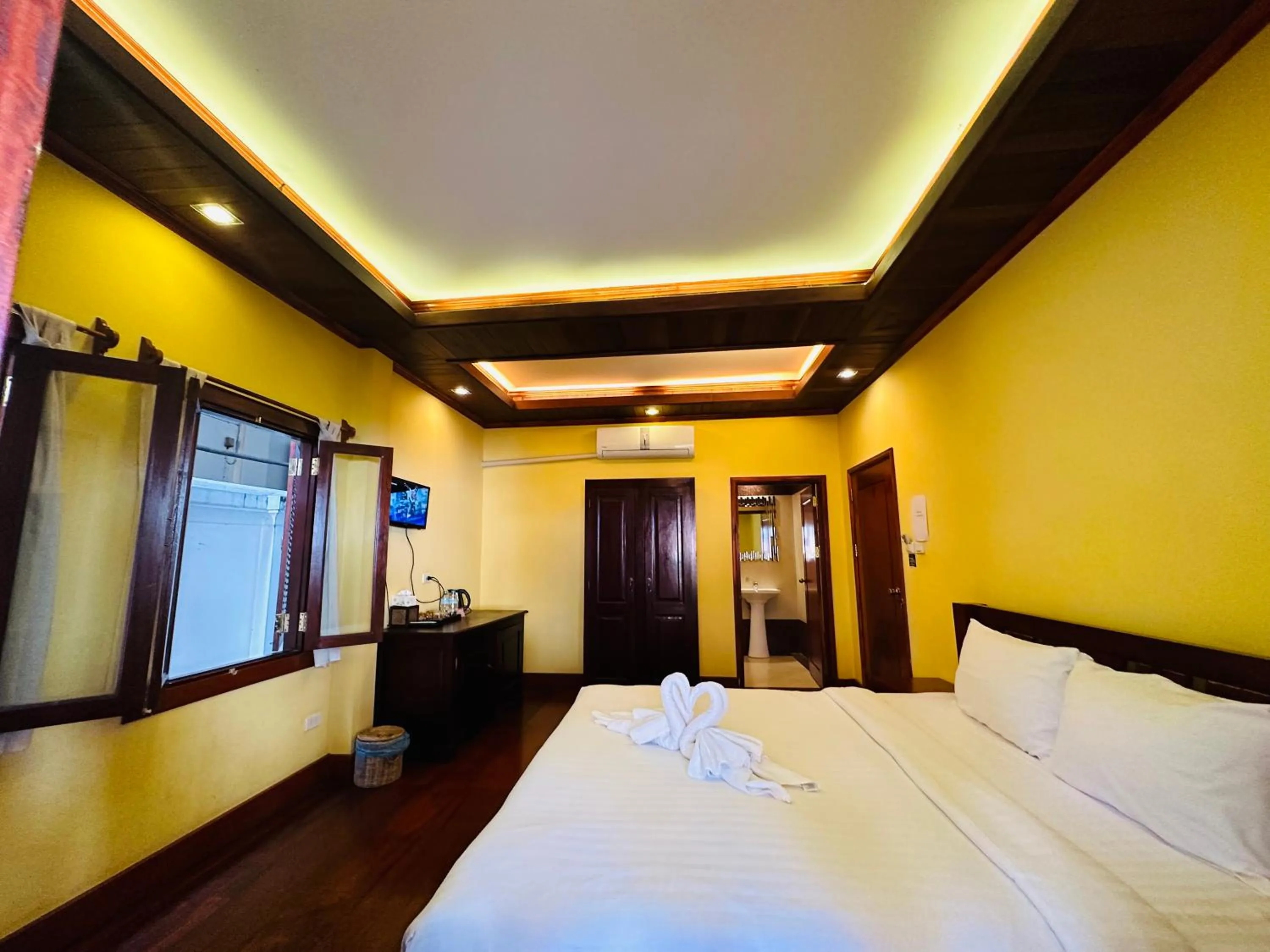 Bed in Villa Phonethip Mekong Riverside