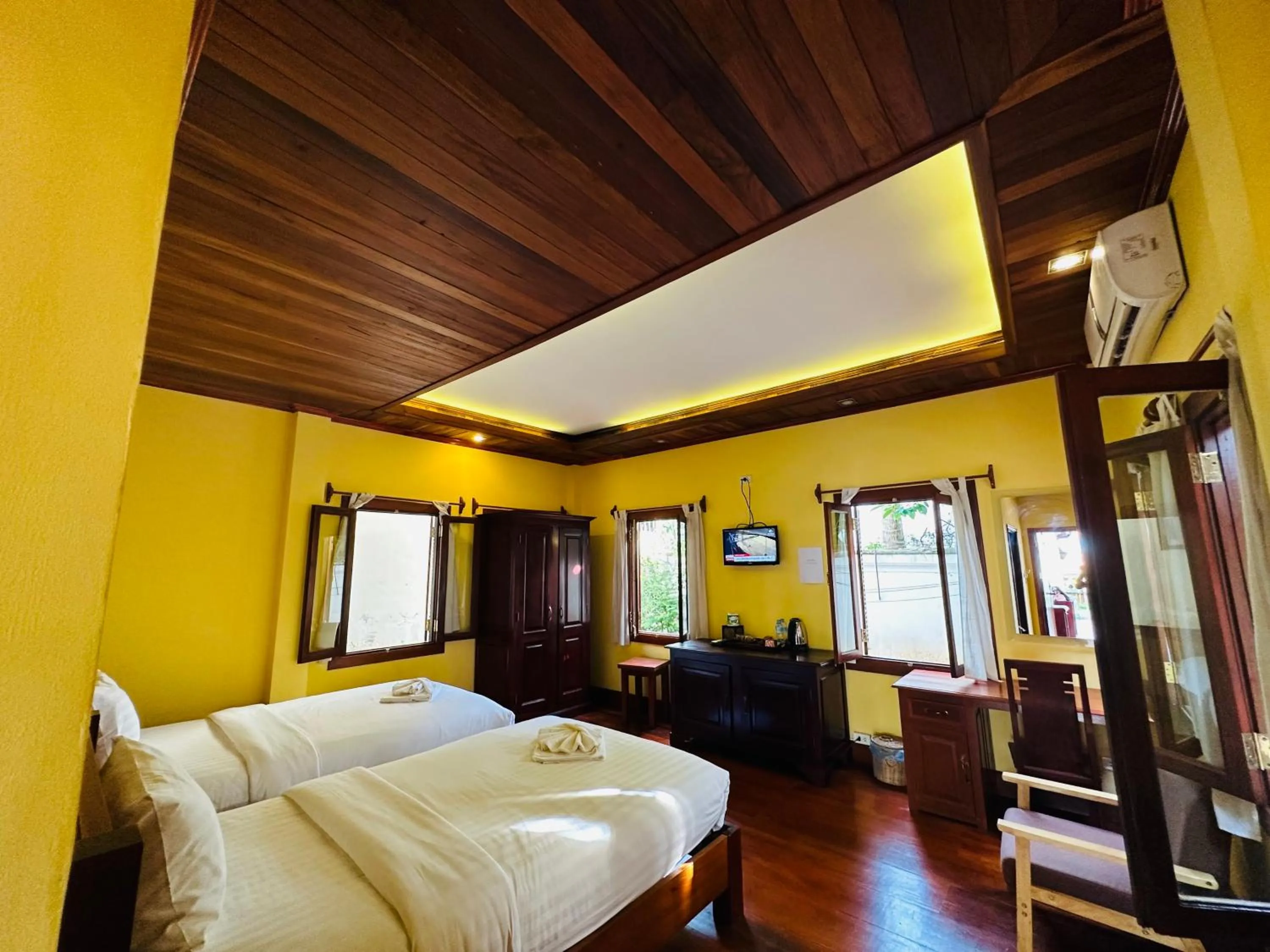 Communal lounge/ TV room, Bed in Villa Phonethip Mekong Riverside