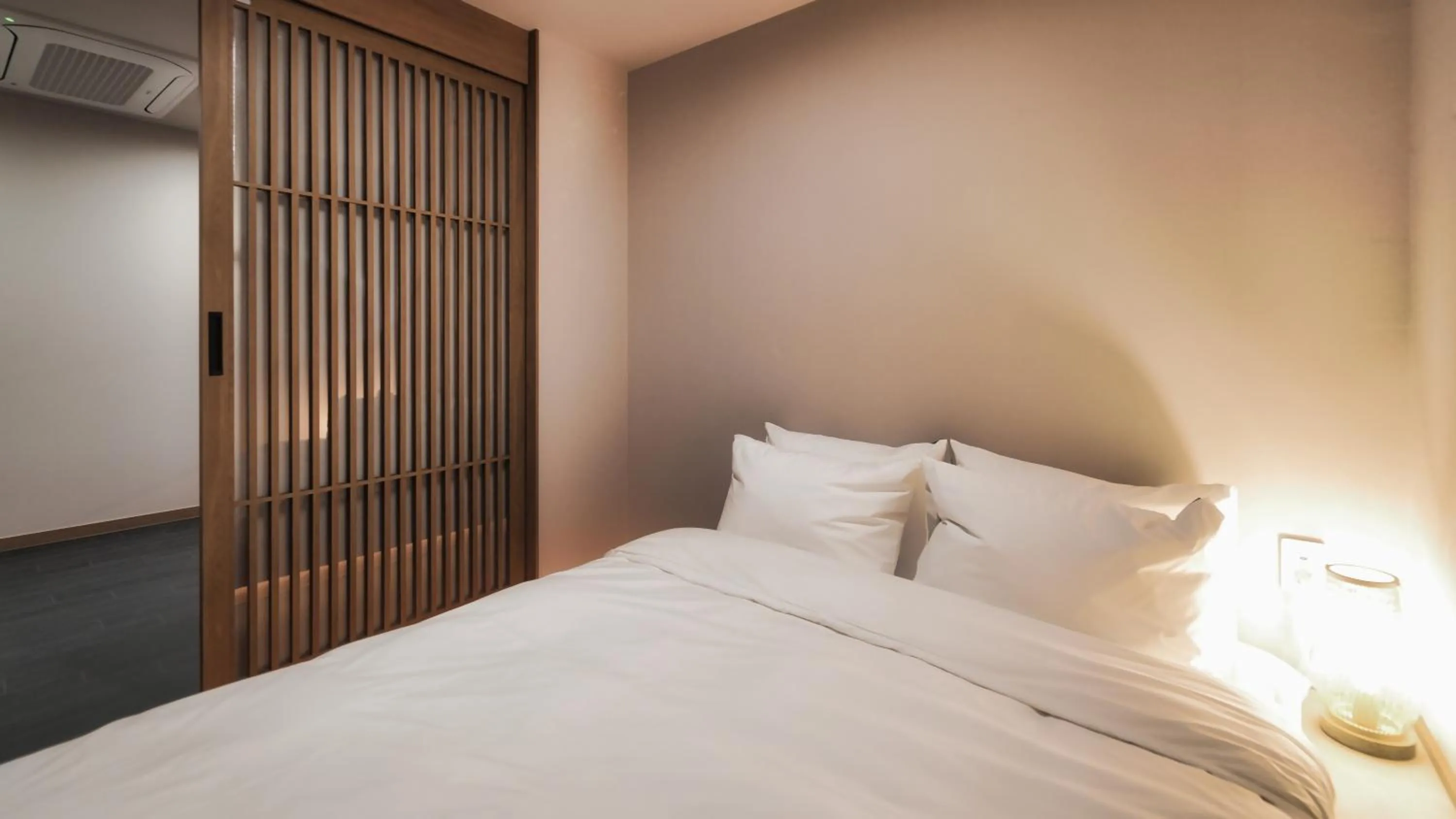 Bed in Gyeongju Denbasta Ryokan