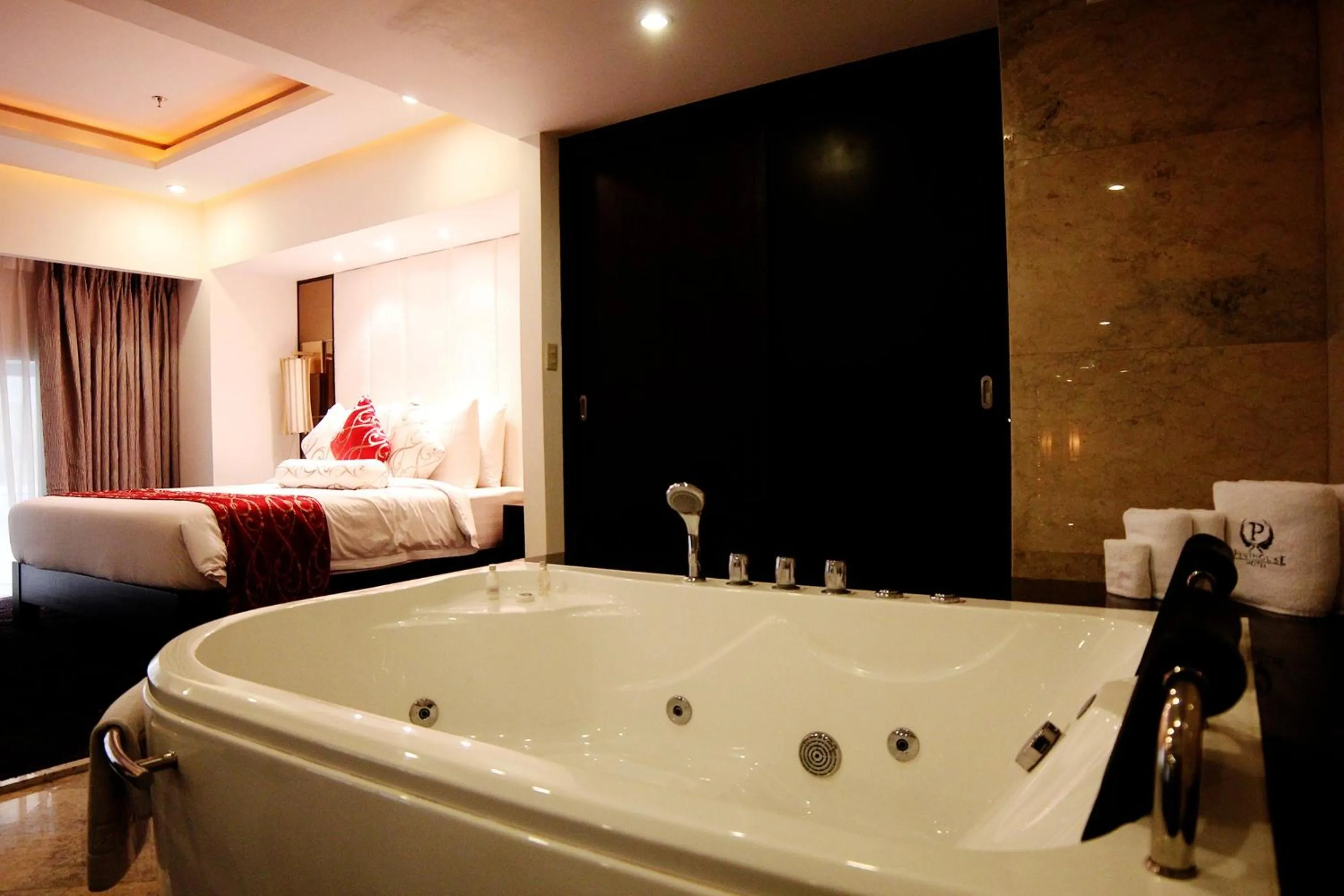 Bed in The Penthouse Hotel and Residences