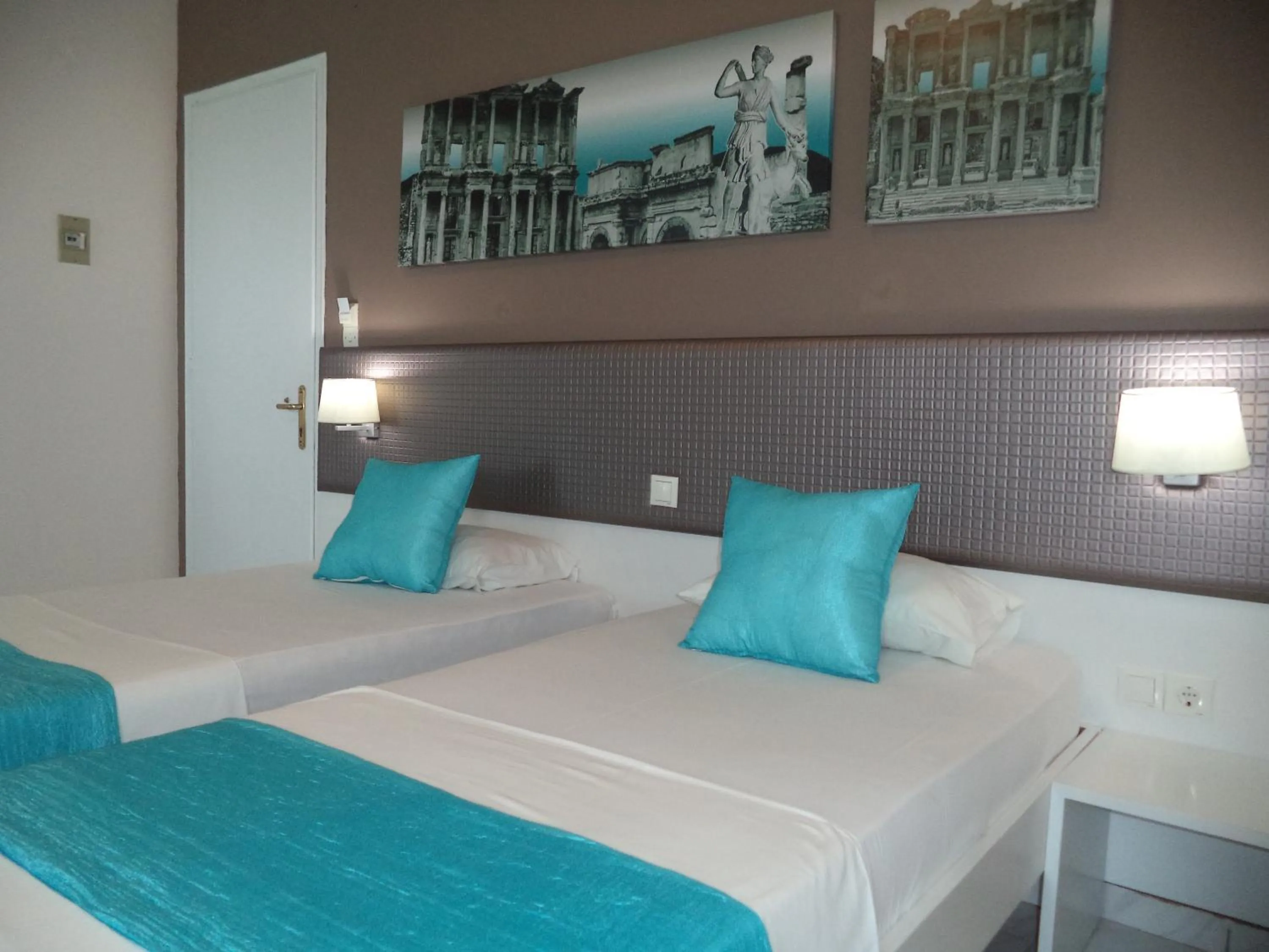 Bed in Blue Nest Hotel