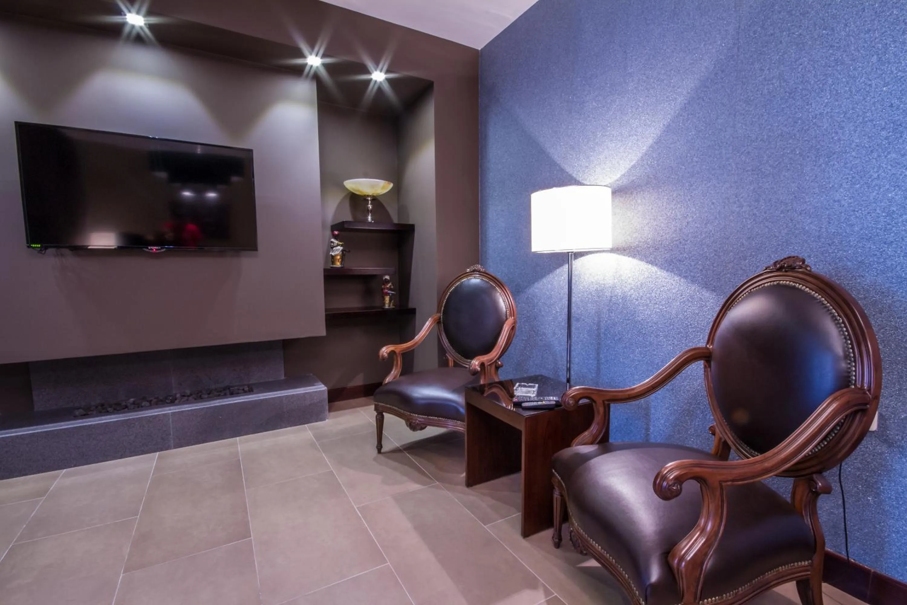 Communal lounge/ TV room in Nadine Hotel Suites