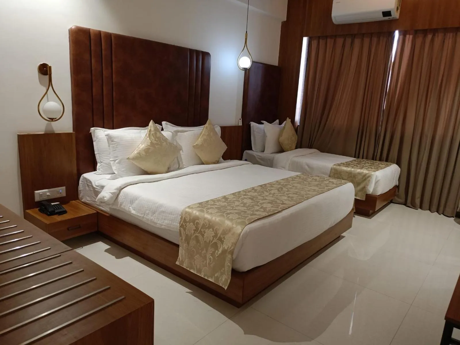 Bed in Lords Eco Inn, Ambaji