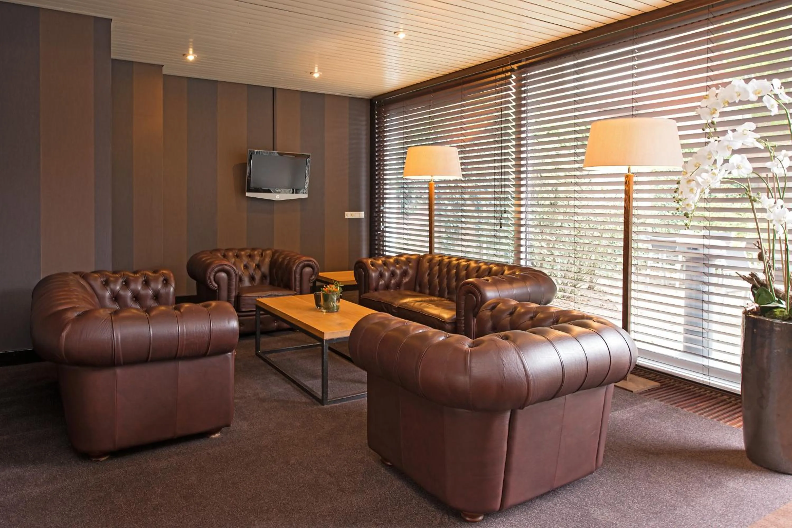 Communal lounge/ TV room in Fletcher Hotel Restaurant Prinsen