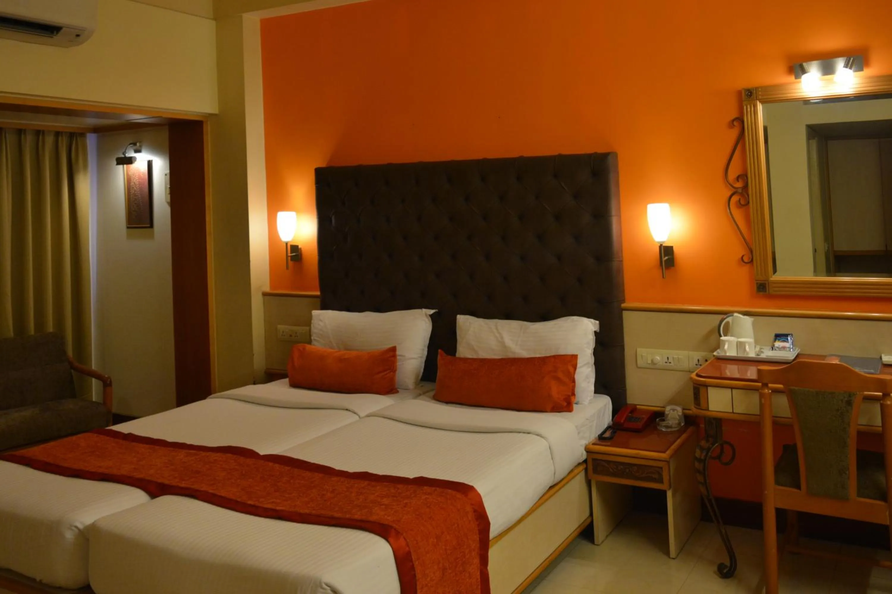 Bed in Hotel Shree Panchratna Pune