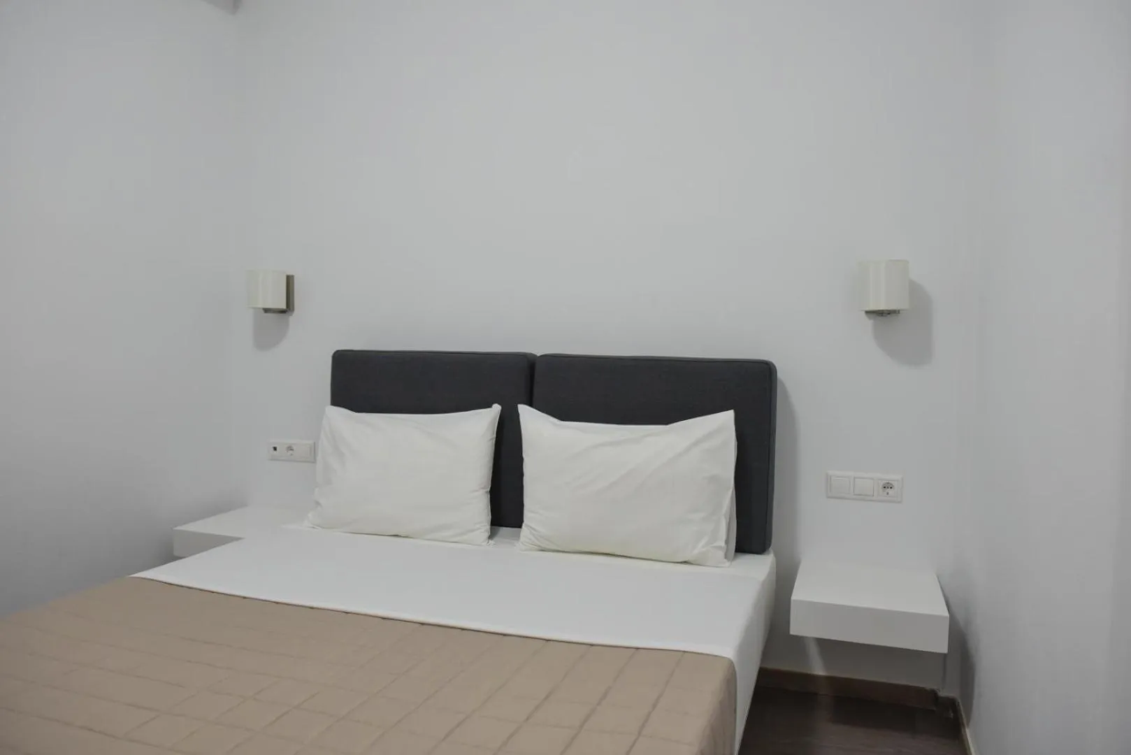 Bed in Aestas Apartments