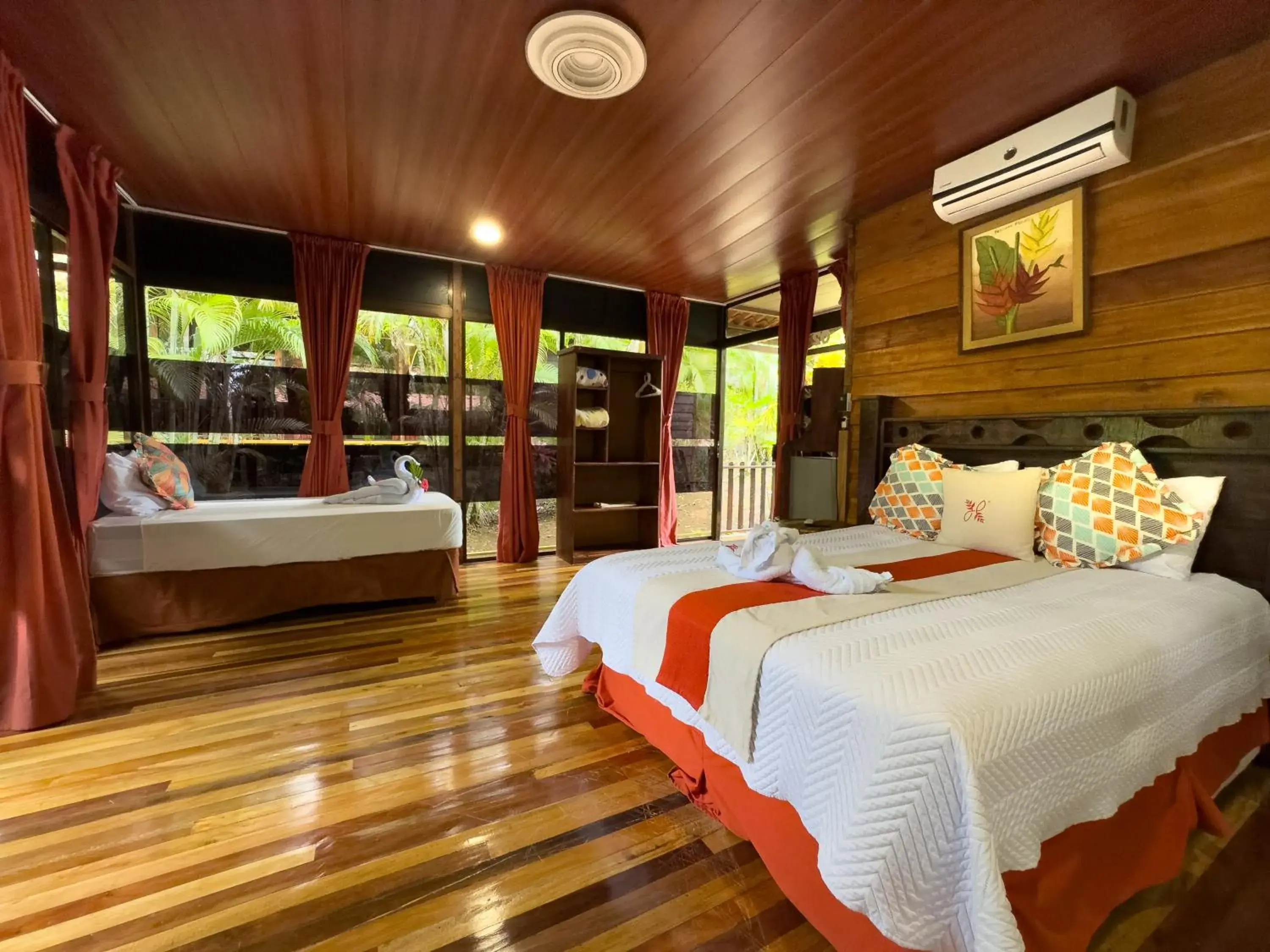 Glass Bungalow with Balcony | 1 Queen Bed & 1 Twin Bed in Hotel Heliconias Nature Inn & Hot Springs Glass Bungalow with Balcony | 1 Queen Bed & 1 Twin Bed in Hotel Heliconias Nature Inn & Hot Springs