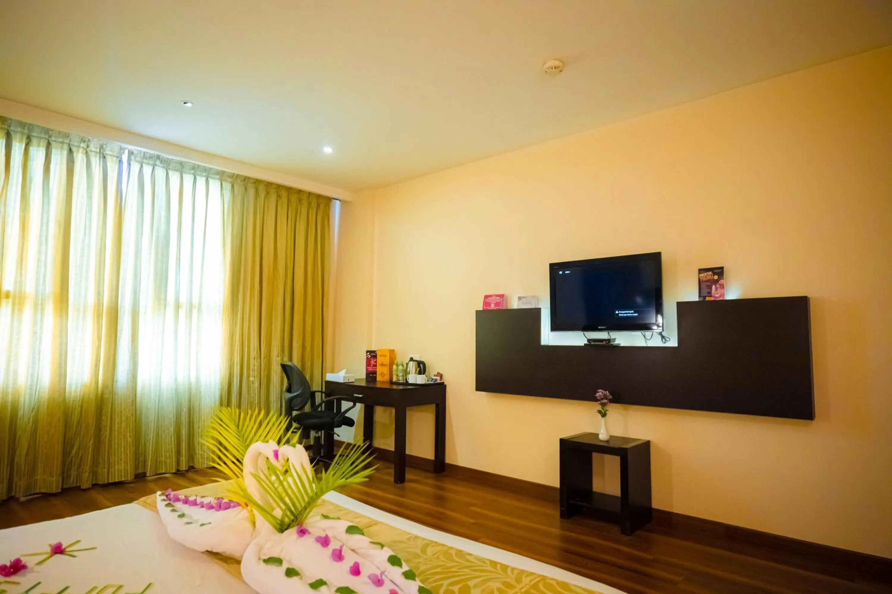 Bed in Poppys Hotel Madurai