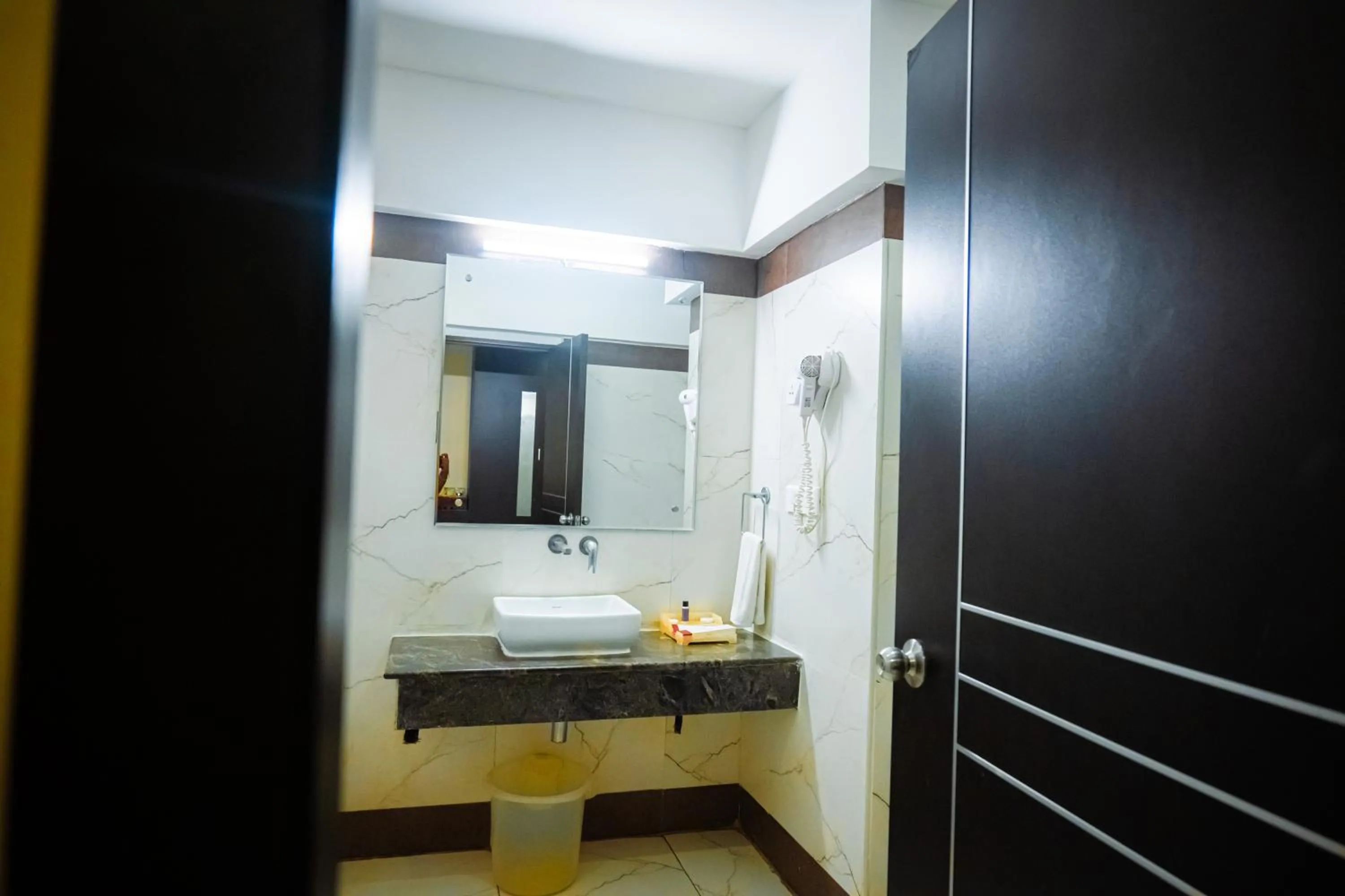 Bathroom, Bed in Poppys Hotel Madurai