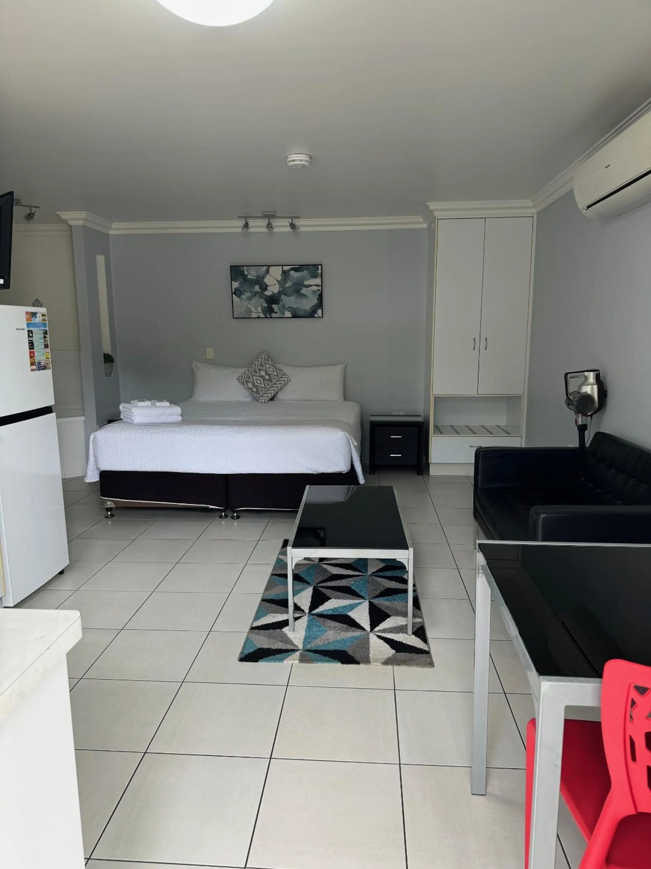 Bed in Charm City Motel