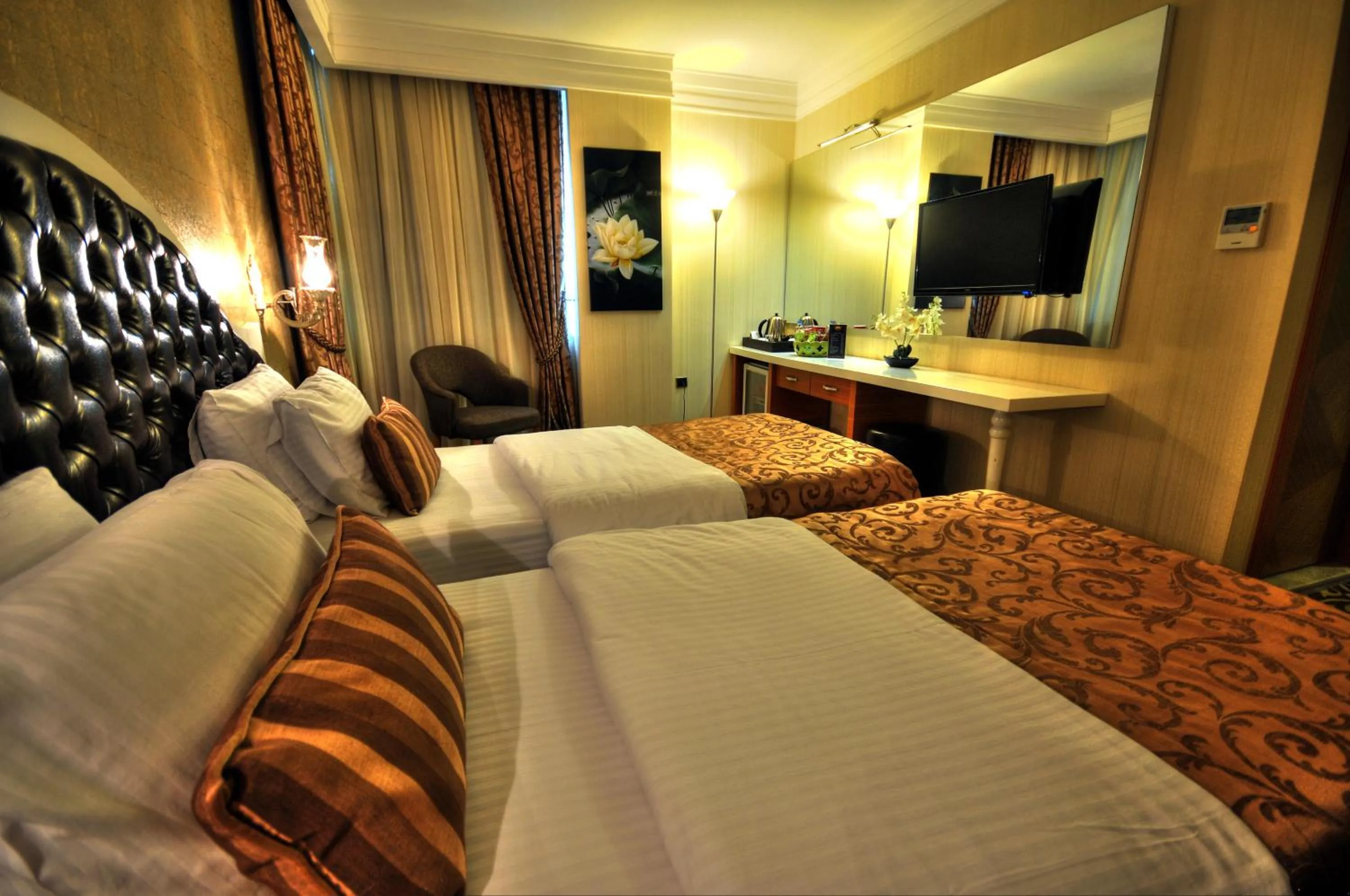 Photo of the whole room, Bed in Golden Deluxe Hotel