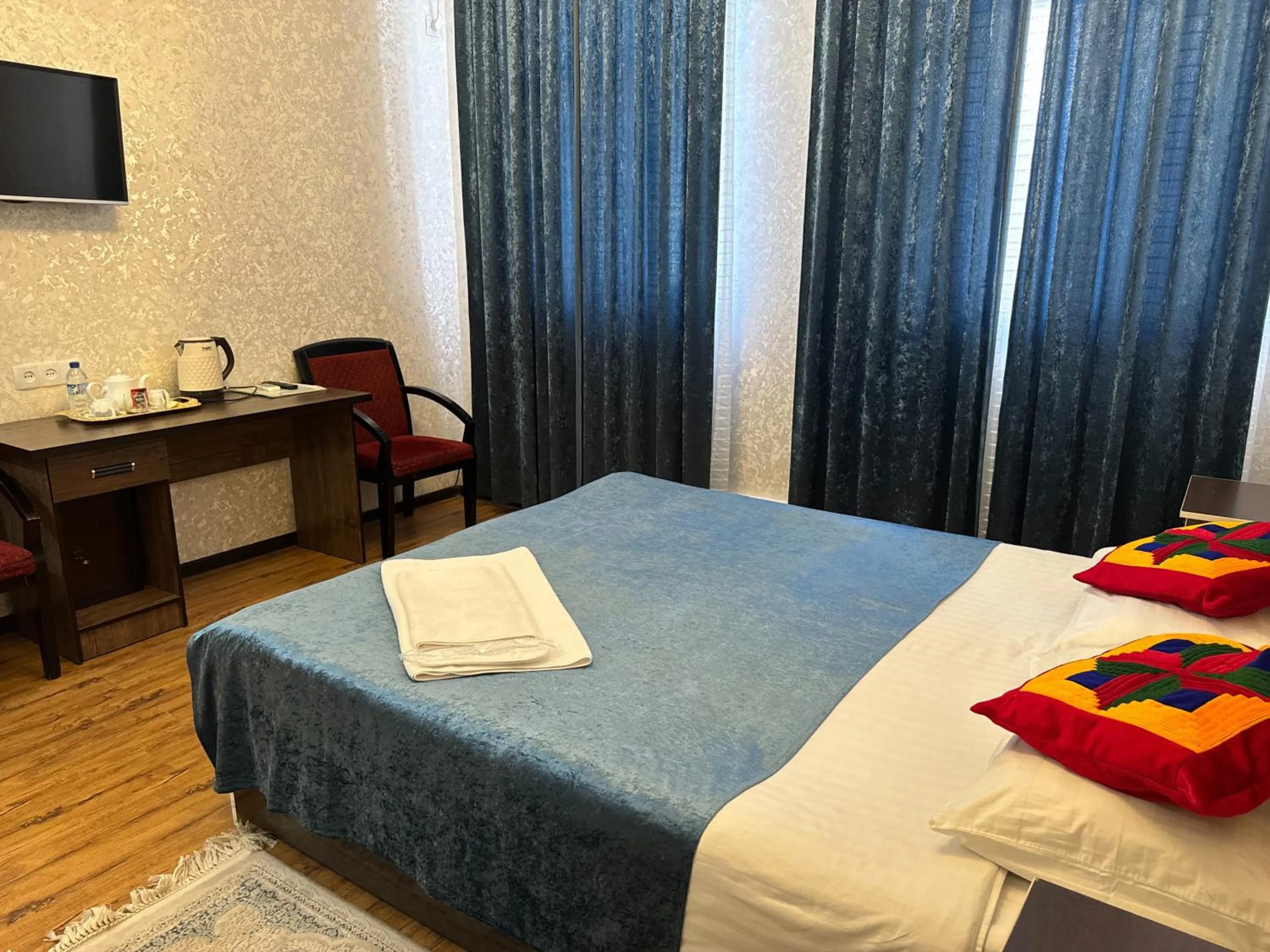 Bed in RATMINA HOTEL