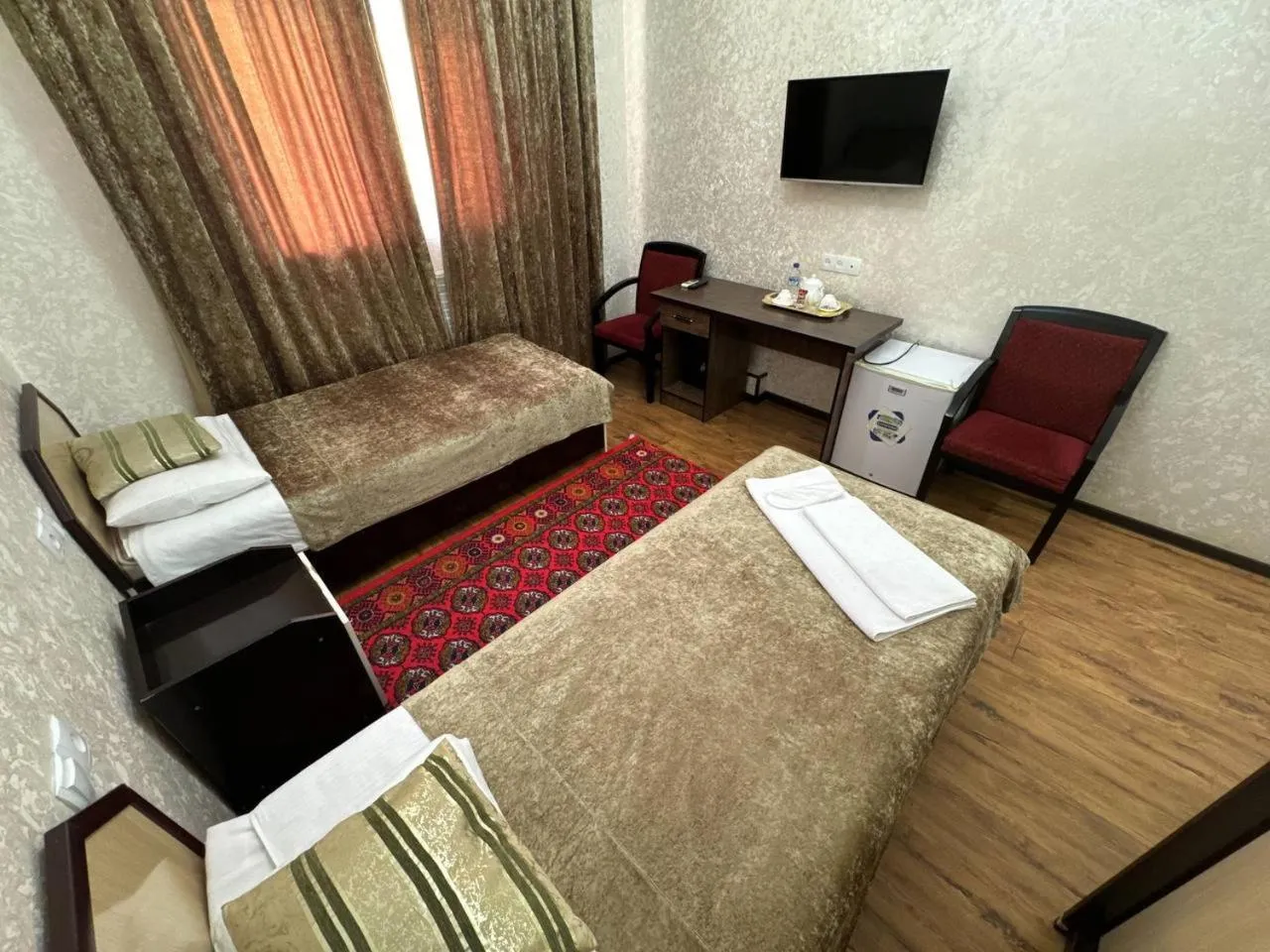 Bed in RATMINA HOTEL