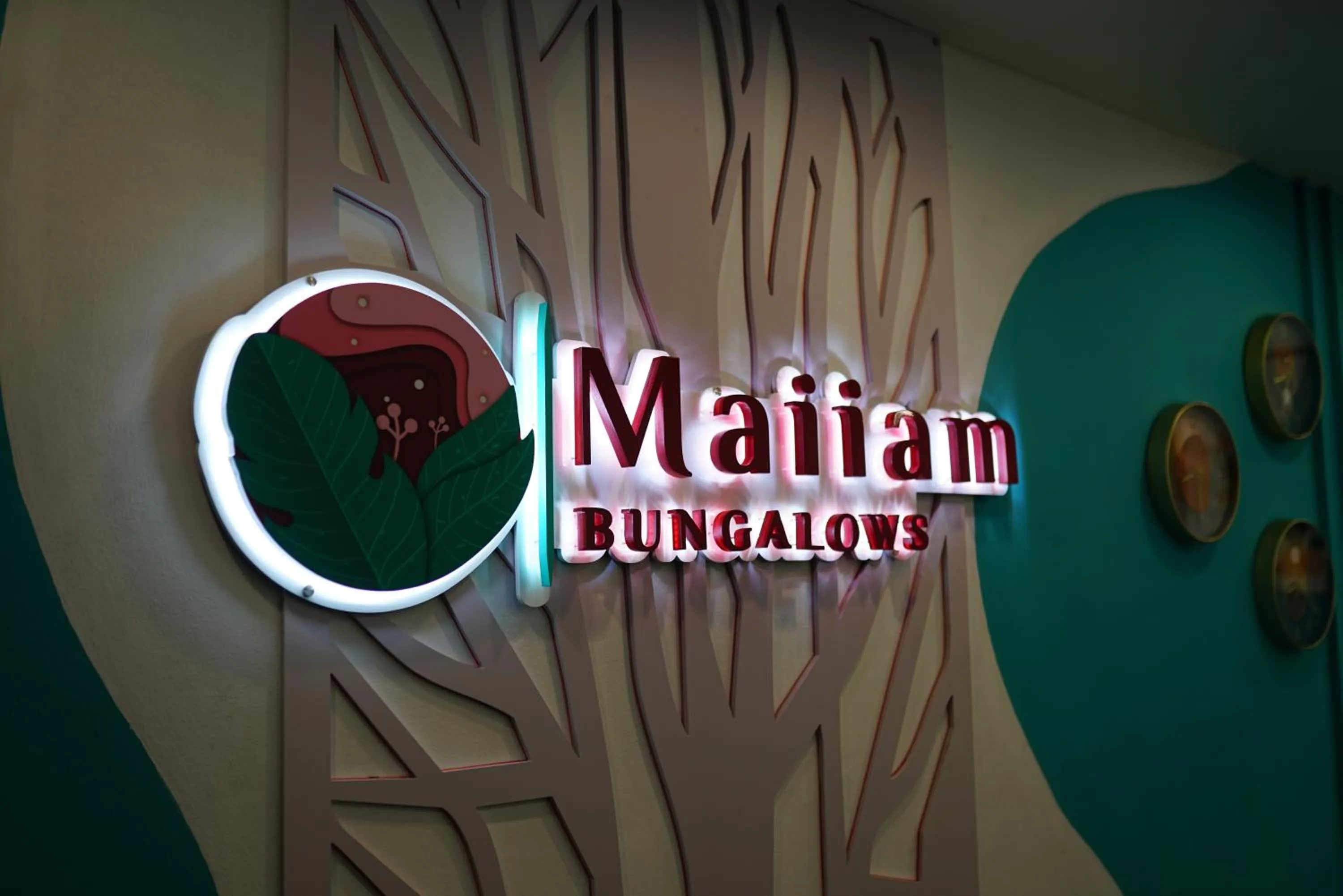 Property logo or sign in Maiiam Bungalows Kata Beach