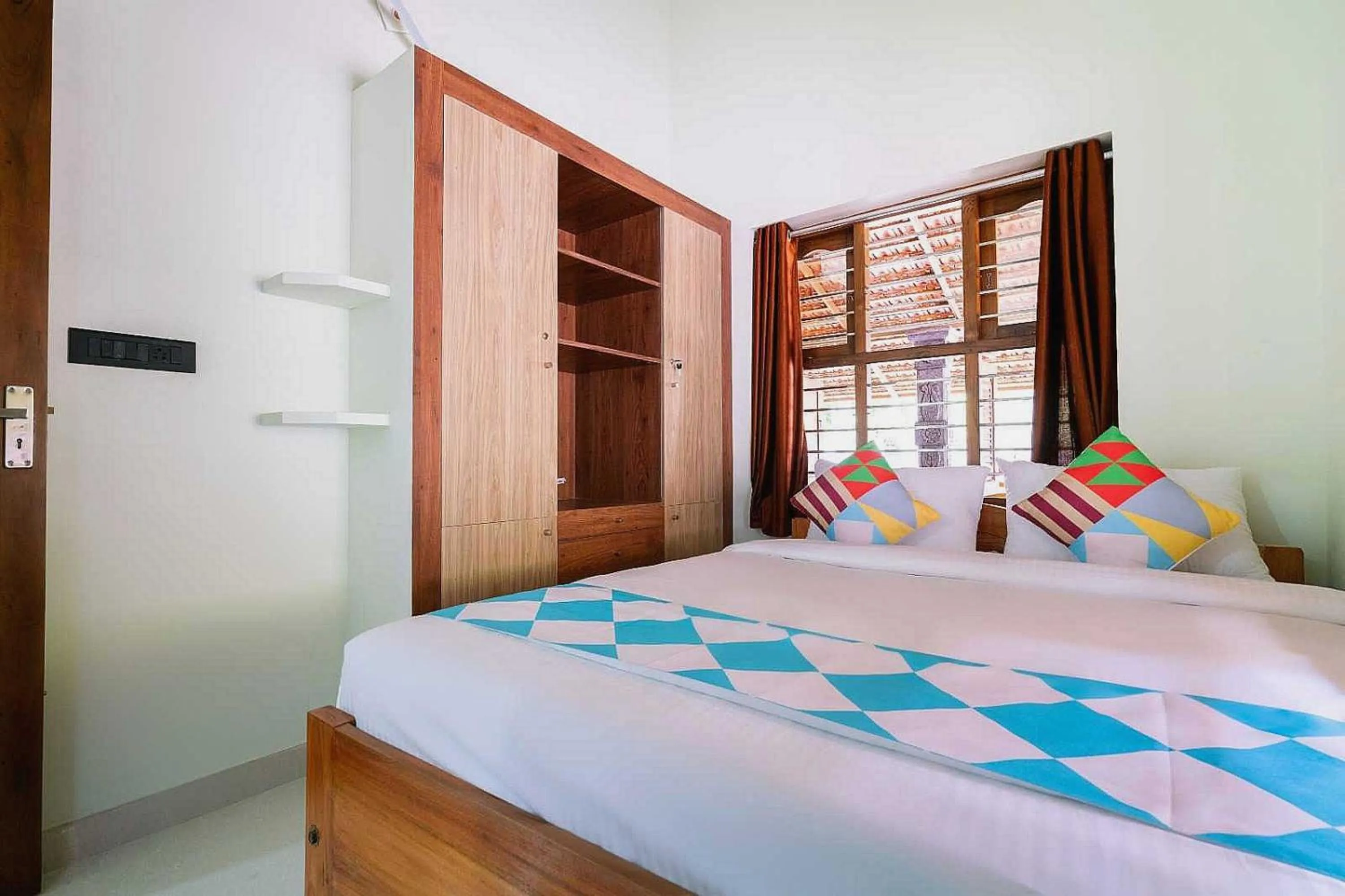 Bedroom in Hotel O ATHARVAM RESORT