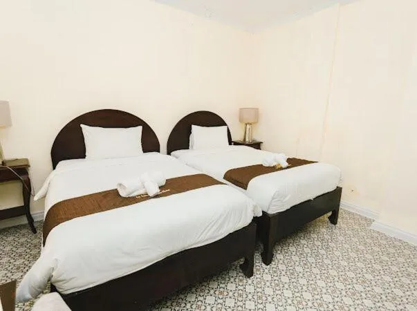 Bed in Le Luxe Boutique Hotel