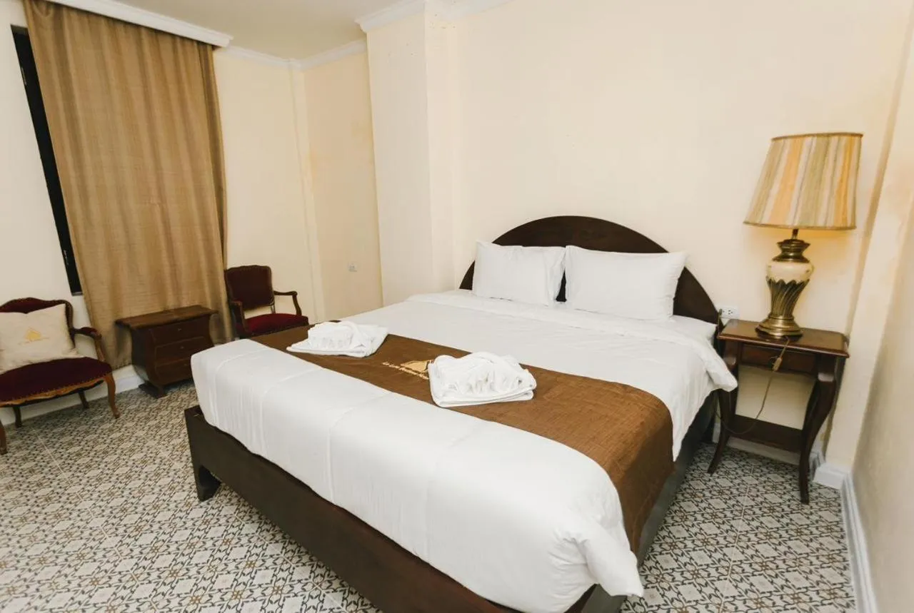 Bed in Le Luxe Boutique Hotel