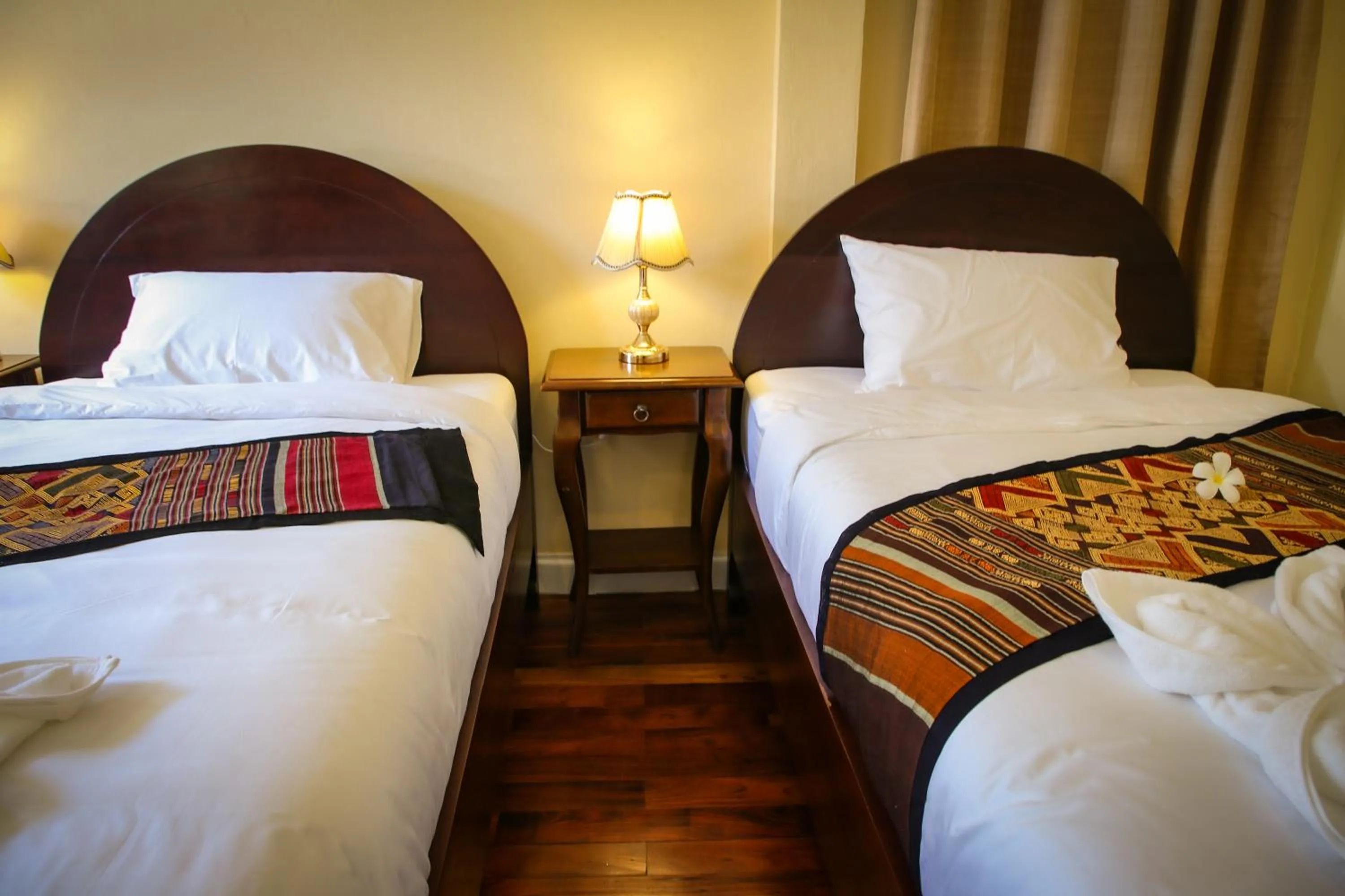 Bed in Le Luxe Boutique Hotel