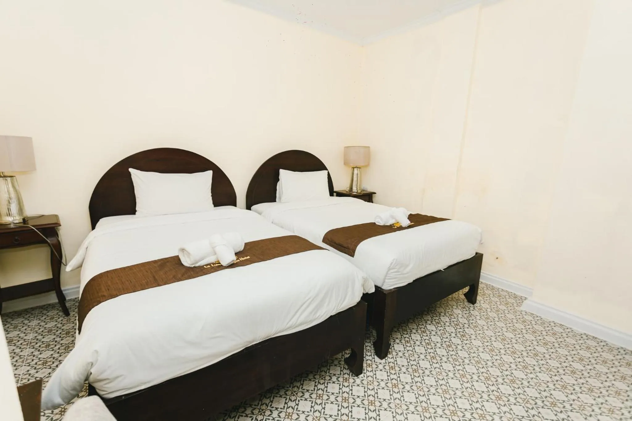 Bed in Le Luxe Boutique Hotel