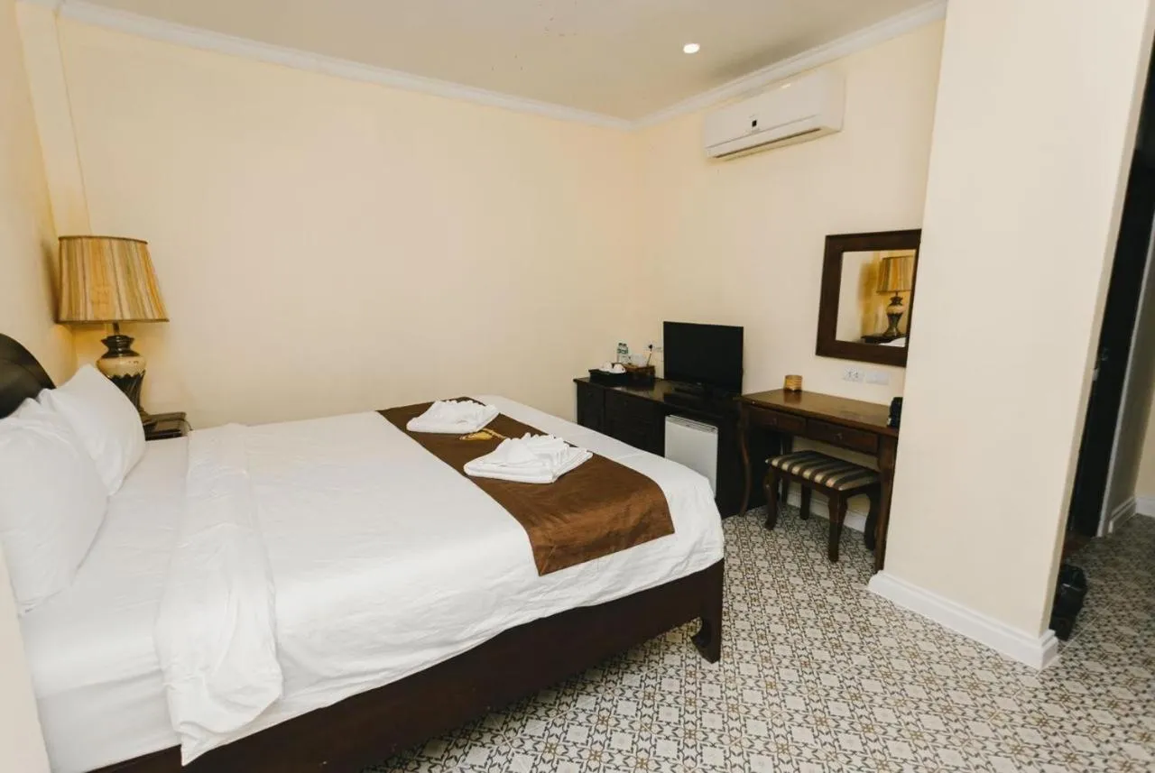 Bed in Le Luxe Boutique Hotel