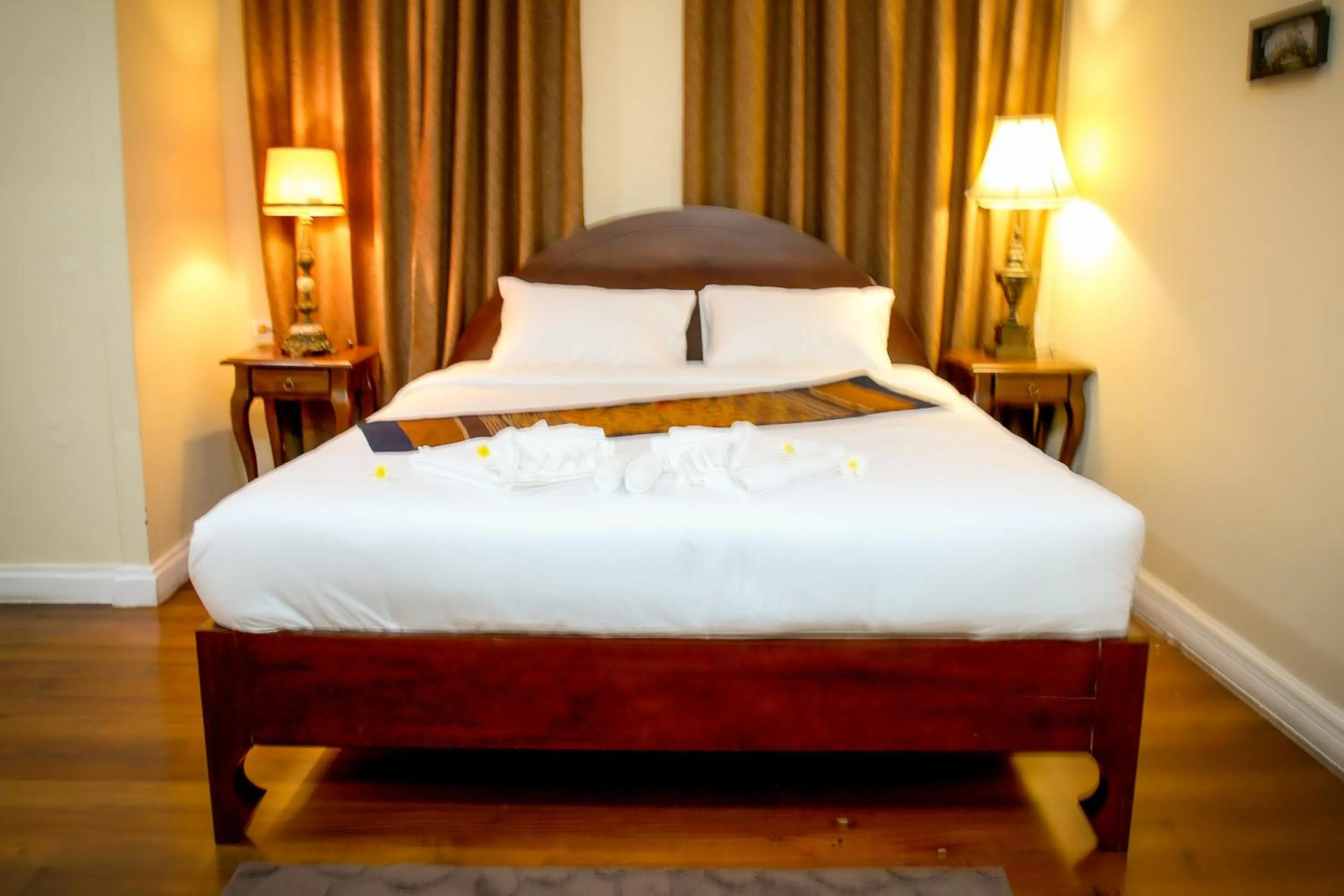Bed in Le Luxe Boutique Hotel