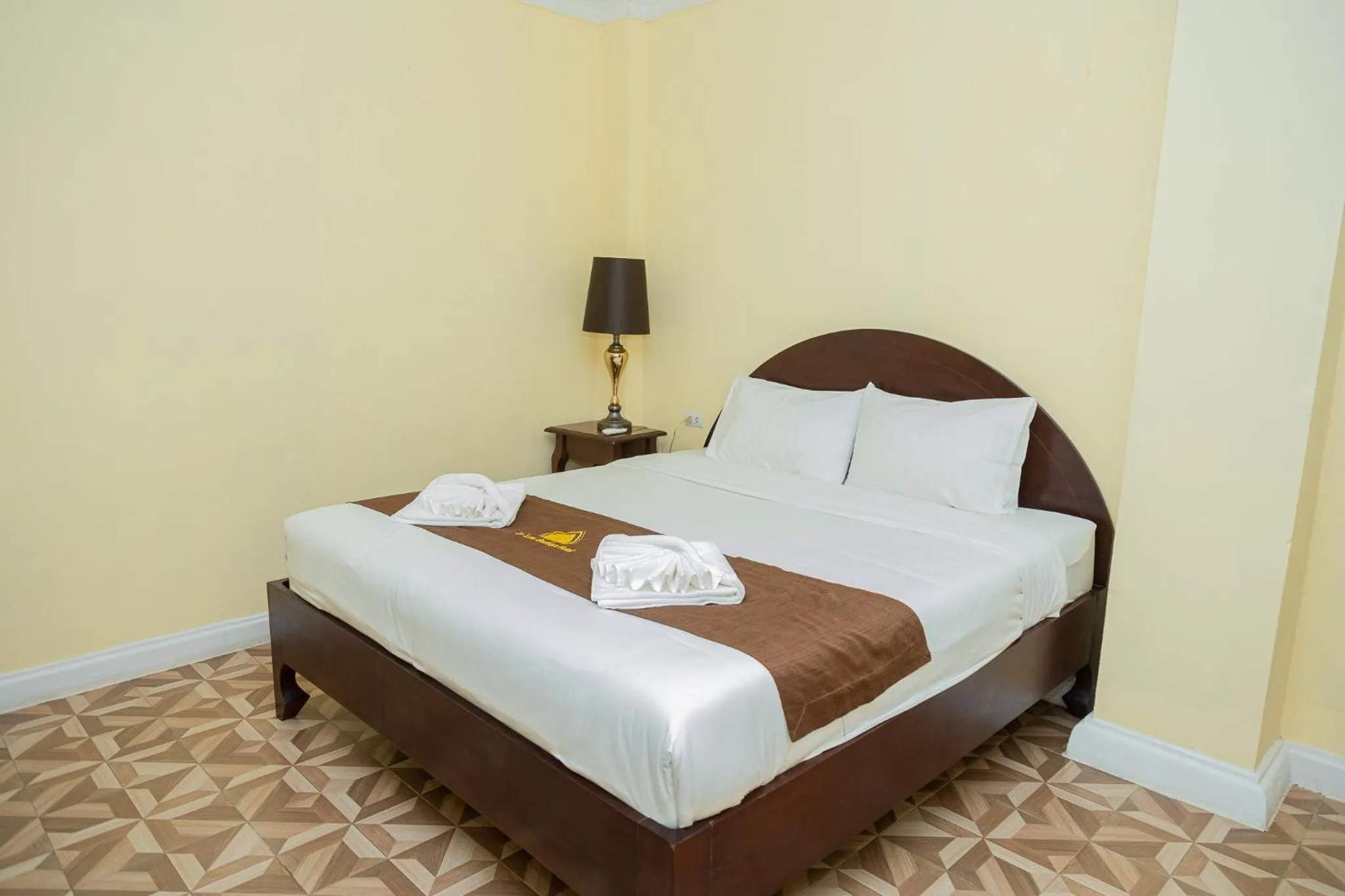 Bed in Le Luxe Boutique Hotel