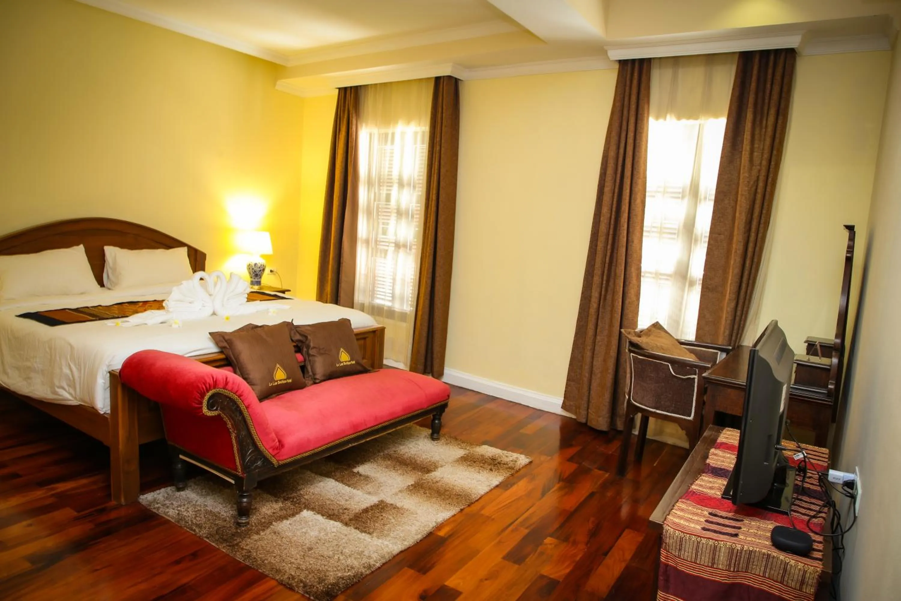 Bed in Le Luxe Boutique Hotel