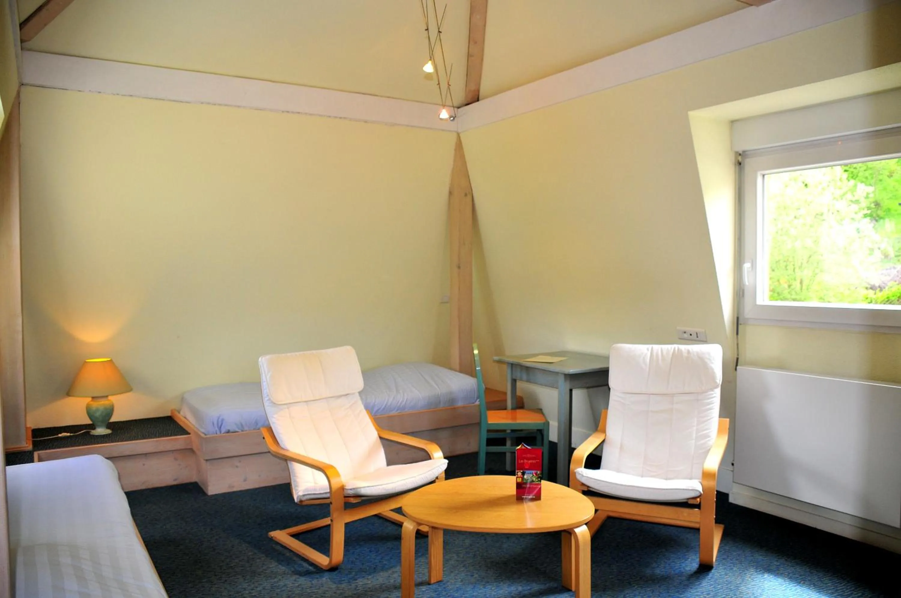 Seating area in Logis Hôtel - Restaurant Aux Bruyères