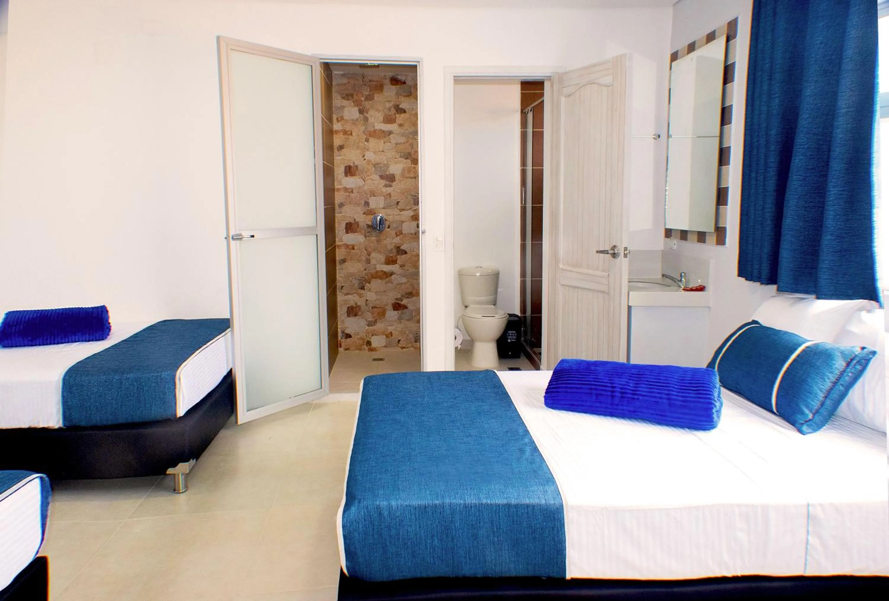 Bed in El Oscar Hotel