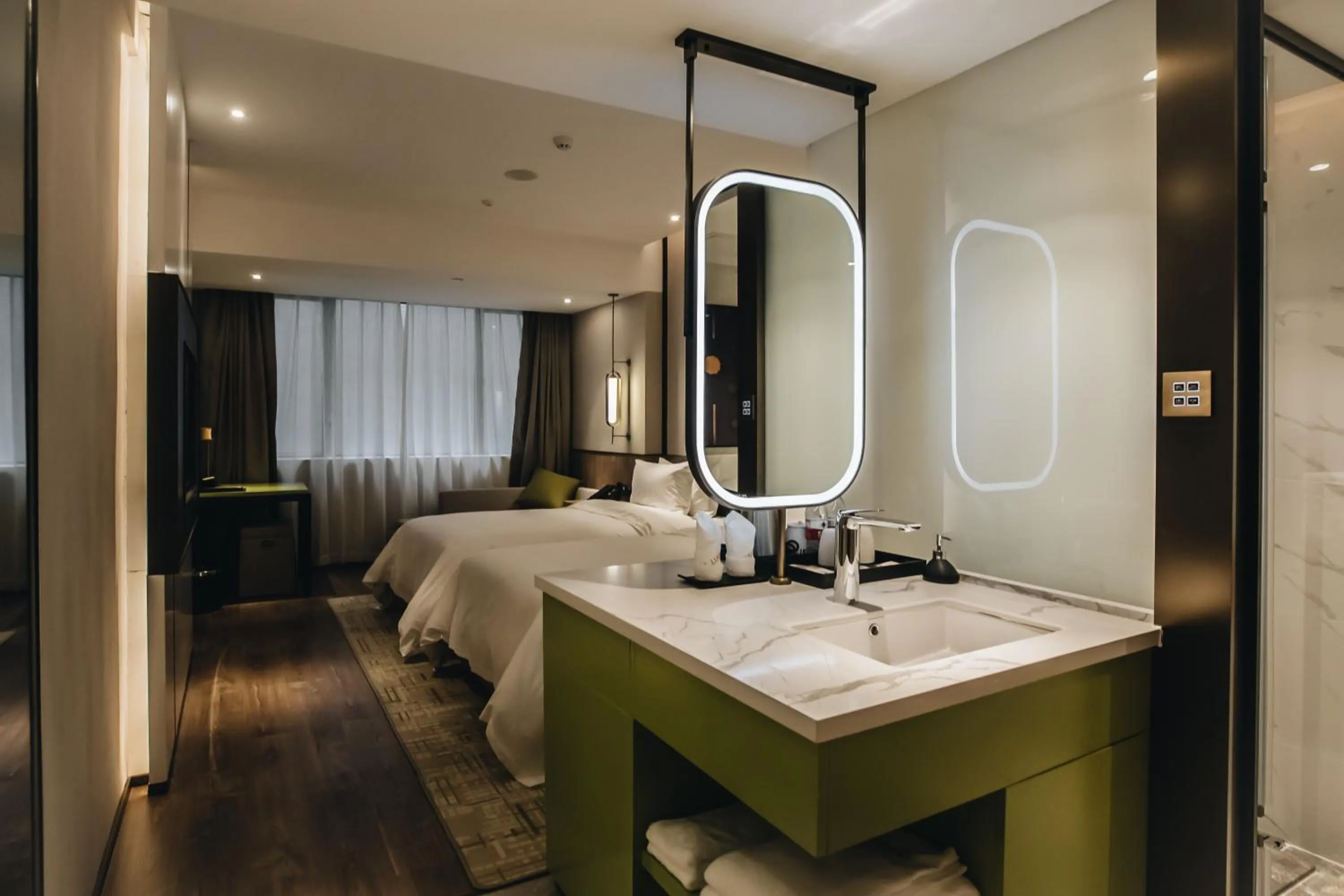 Photo of the whole room, Bed in Orienwit Hotel-Free Shuttle Bus fir Canton Fair