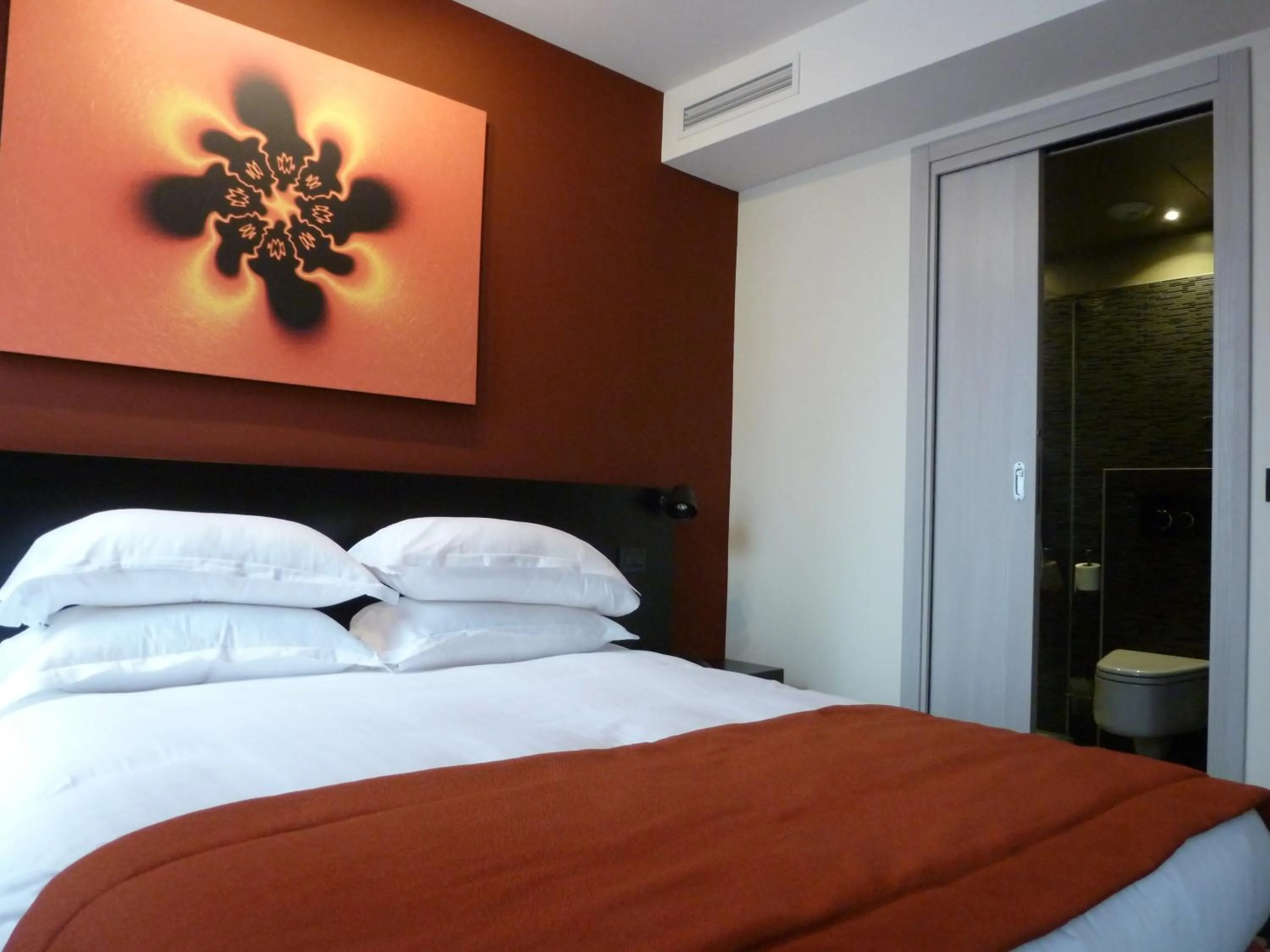 Bed in Helussi Hôtel