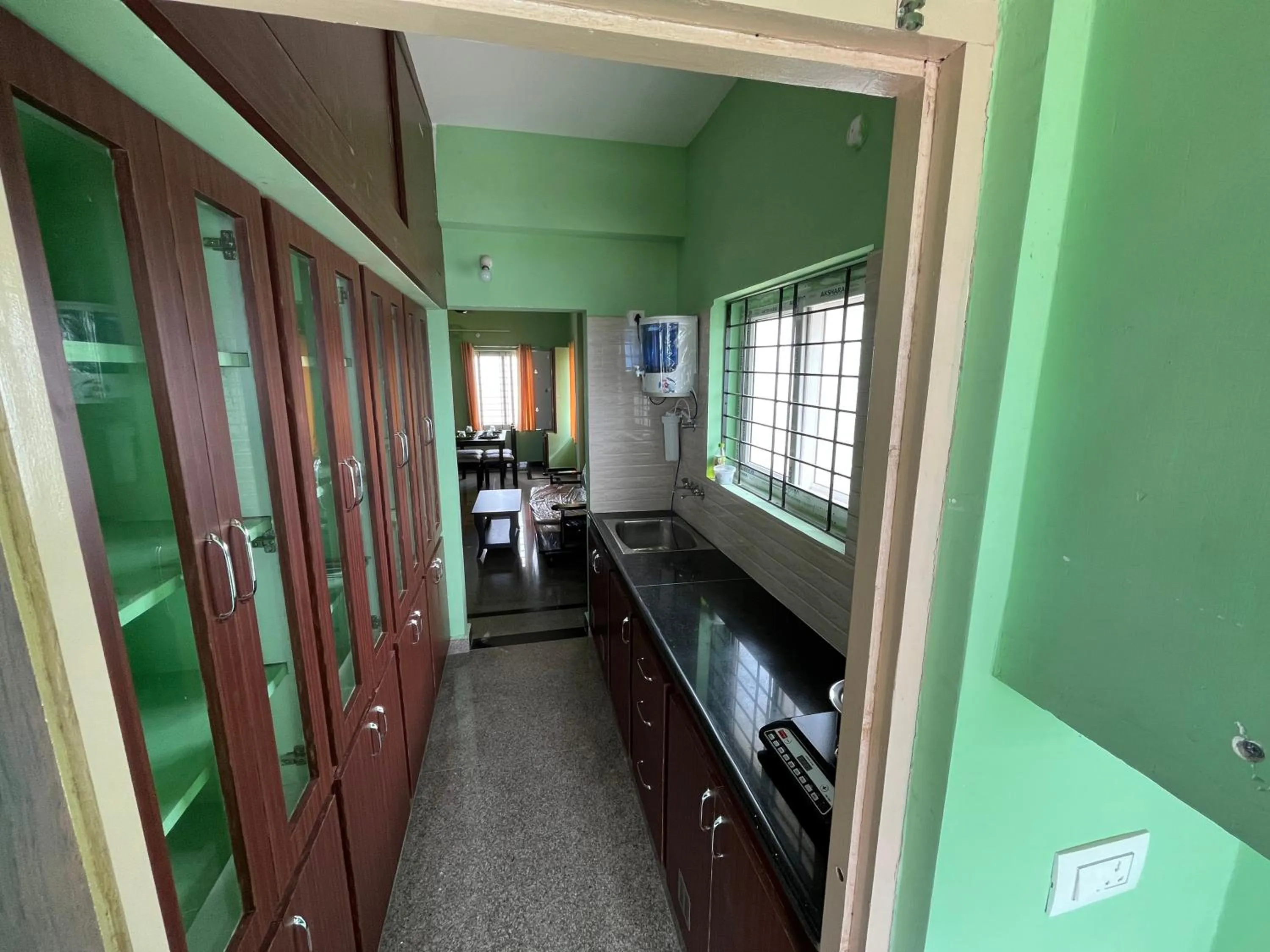 Kitchen or kitchenette in Aditya Homestay