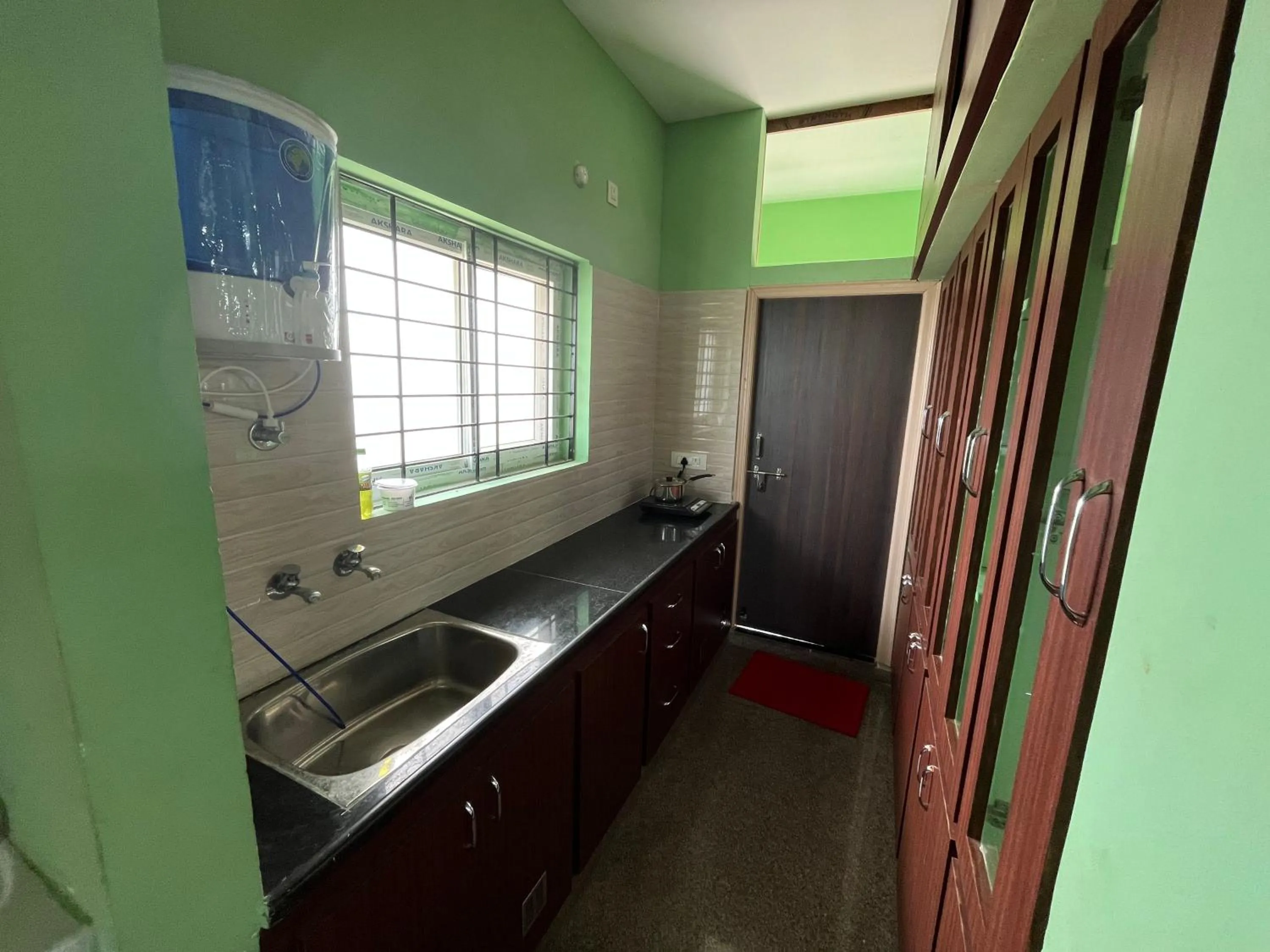 Kitchen or kitchenette in Aditya Homestay