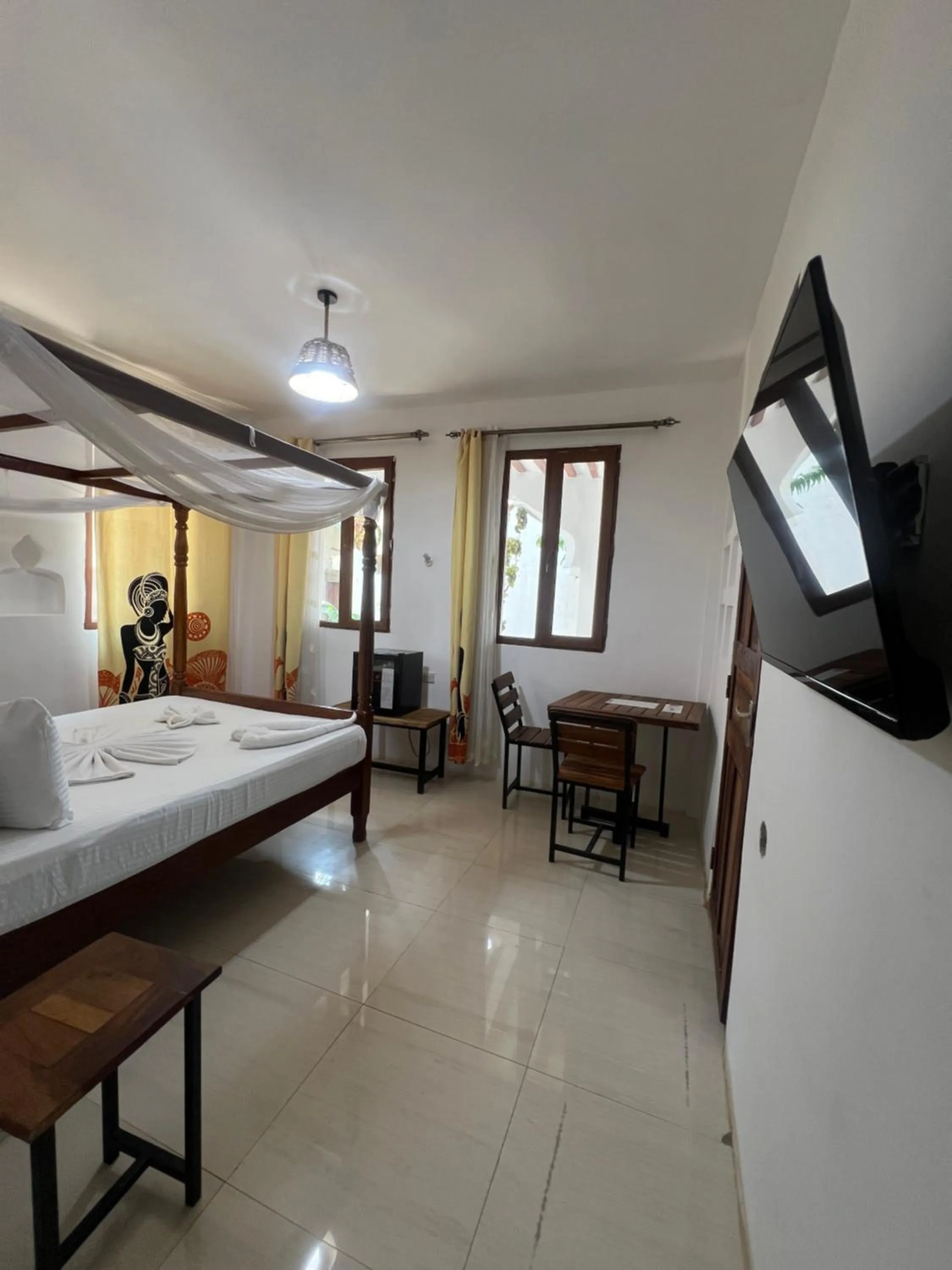 Bed in Light of Zanzibar Hotel