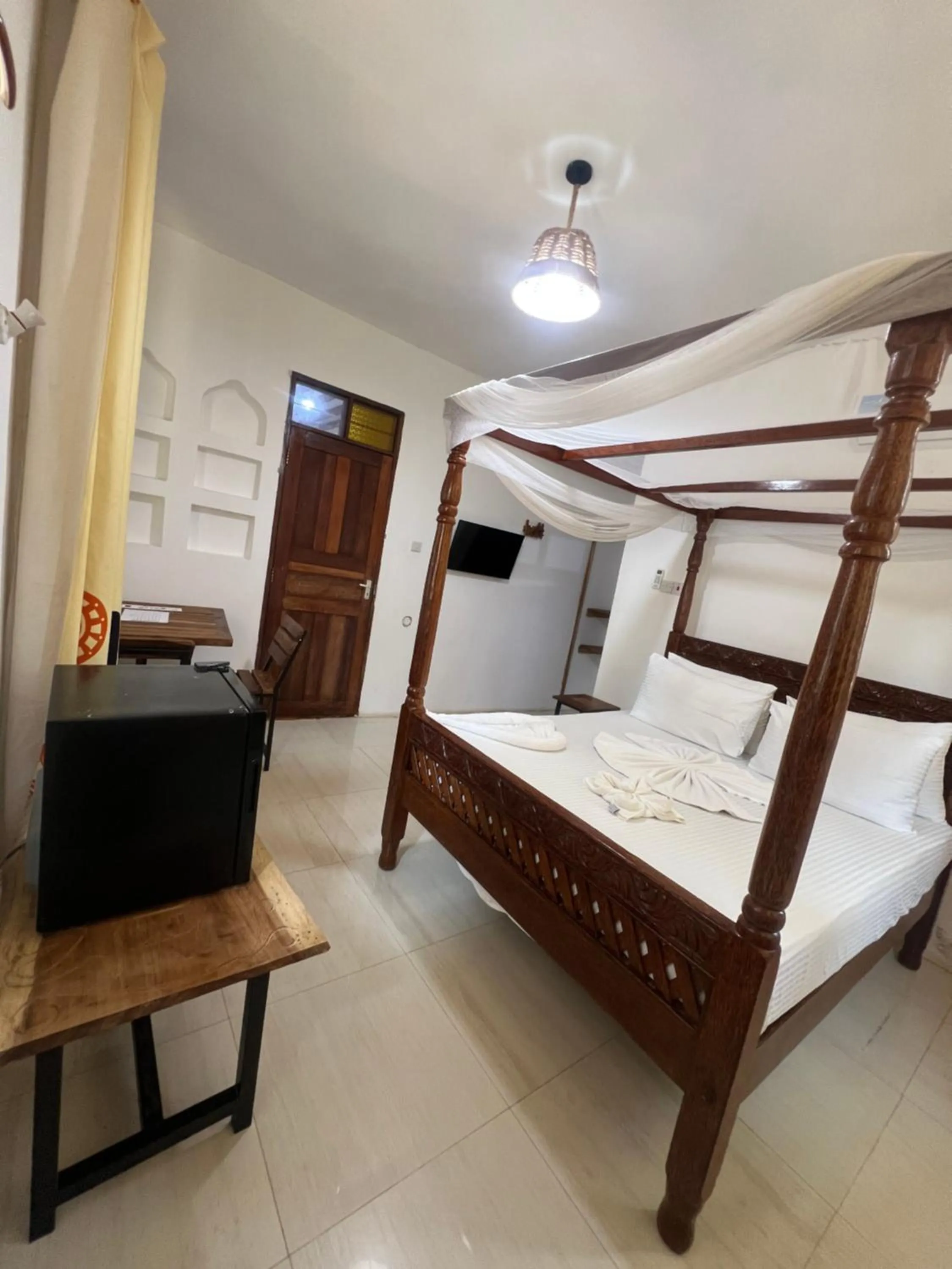 Photo of the whole room, Bed in Light of Zanzibar Hotel