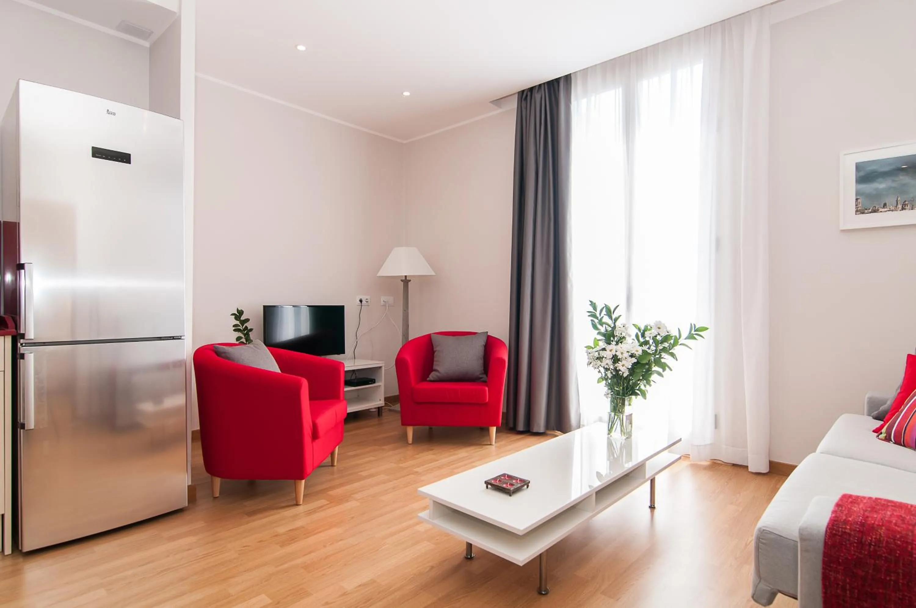 Living room, Bed in Pelayo Deluxe Apartments