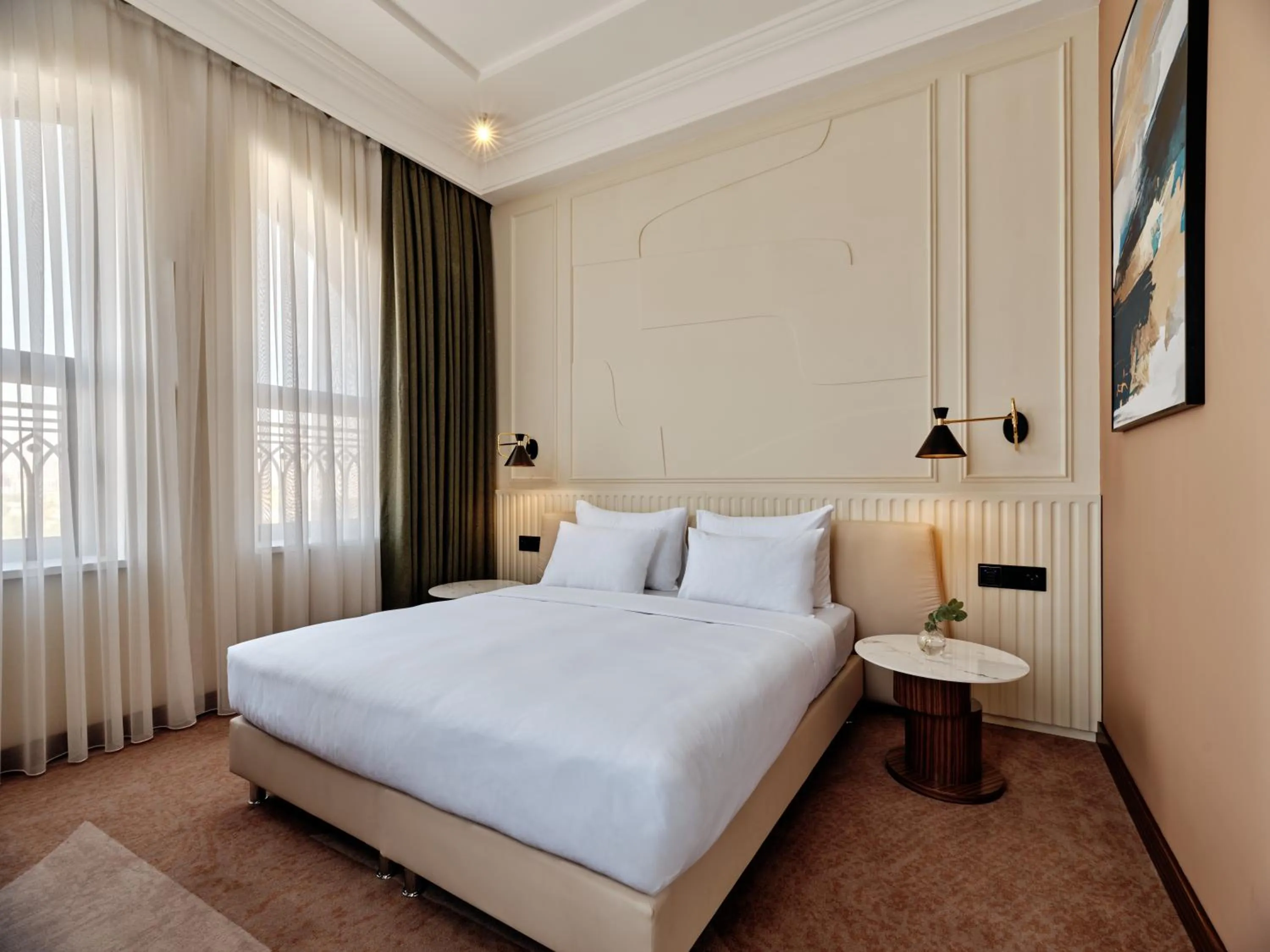 Living room, Bed in Crowne Plaza Tashkent, an IHG Hotel