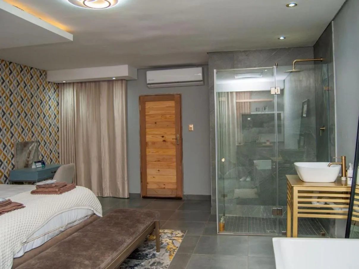Shower, Bed in The Lux Hotel and Resorts