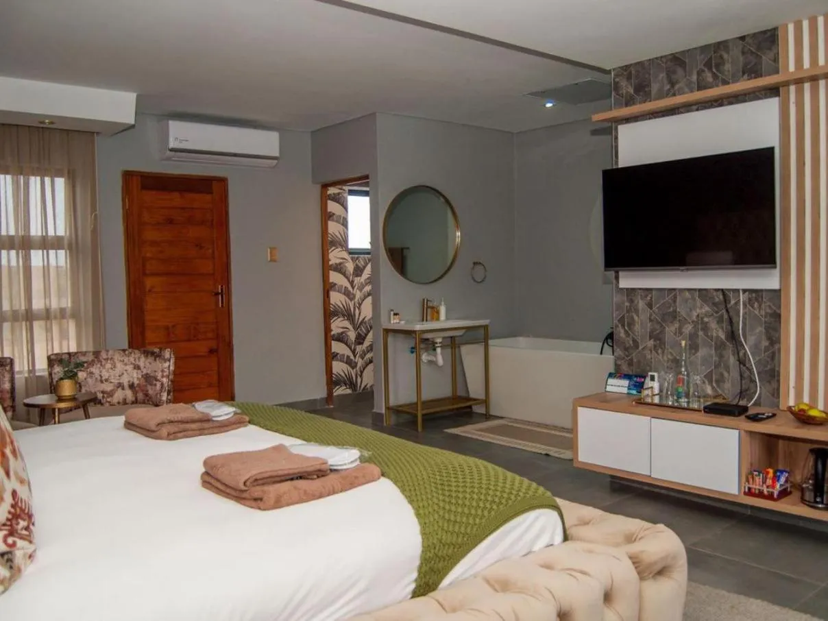 Photo of the whole room, Bed in The Lux Hotel and Resorts