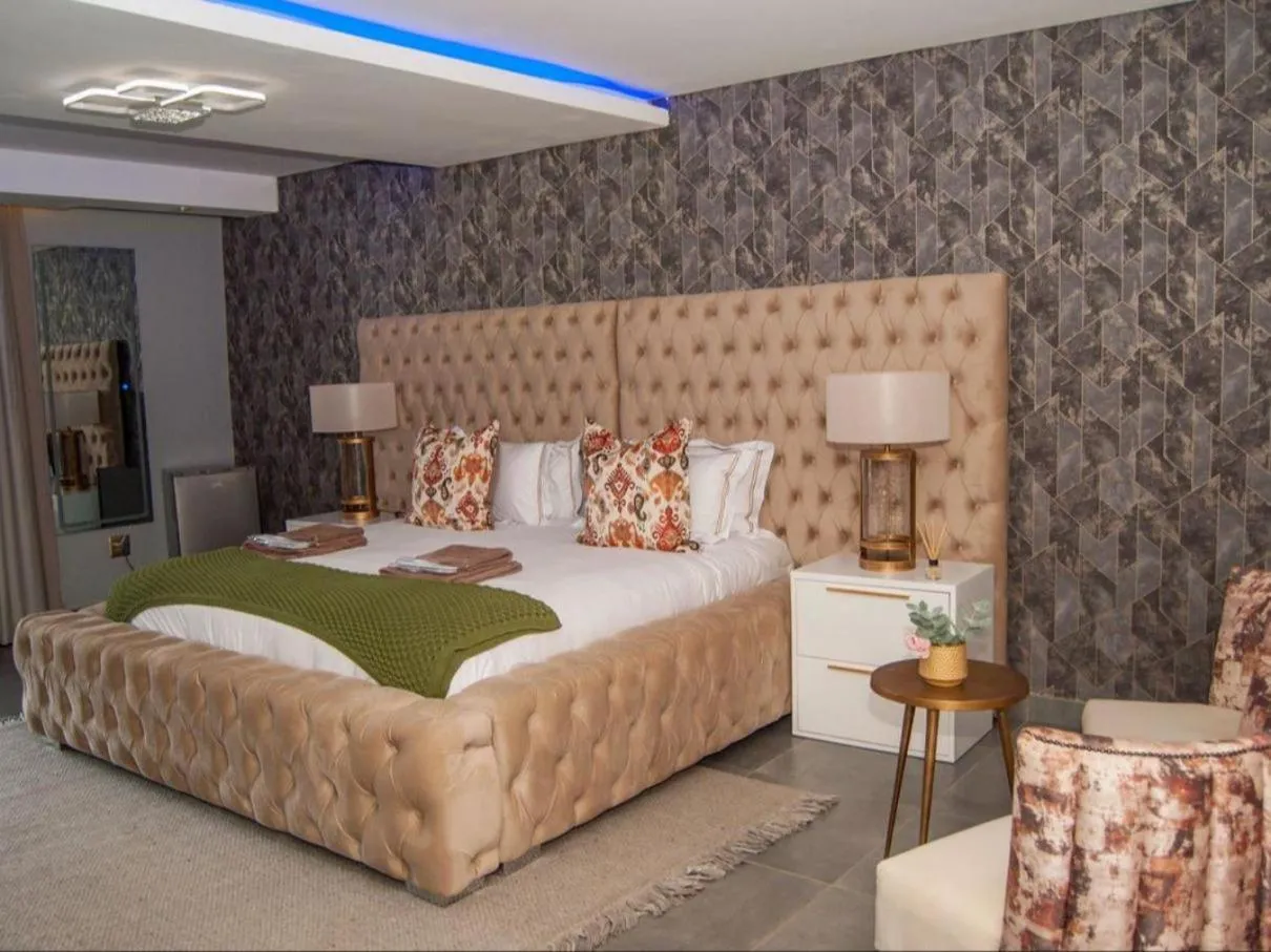 Bed in The Lux Hotel and Resorts