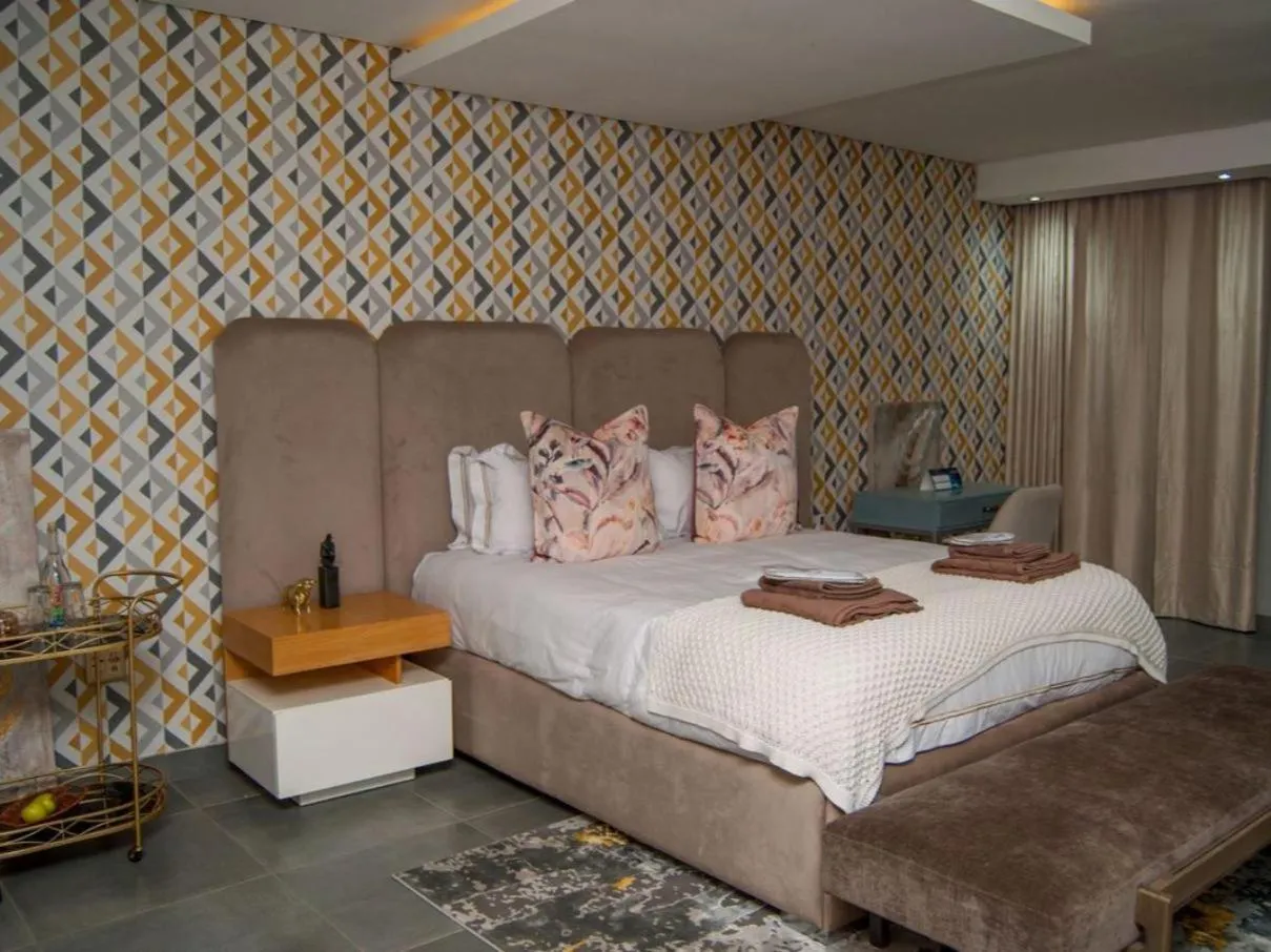 Bed in The Lux Hotel and Resorts