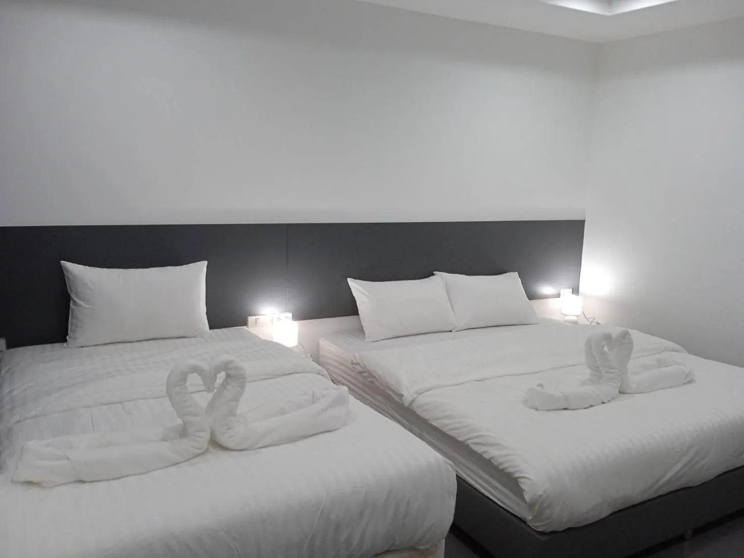 Bed in D Night Suite Hotel