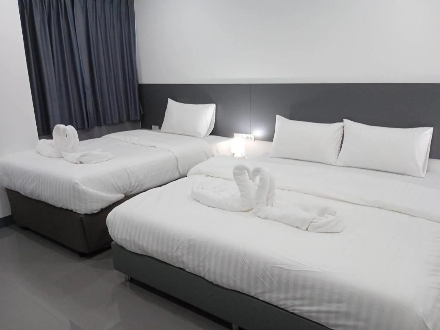 Bed in D Night Suite Hotel