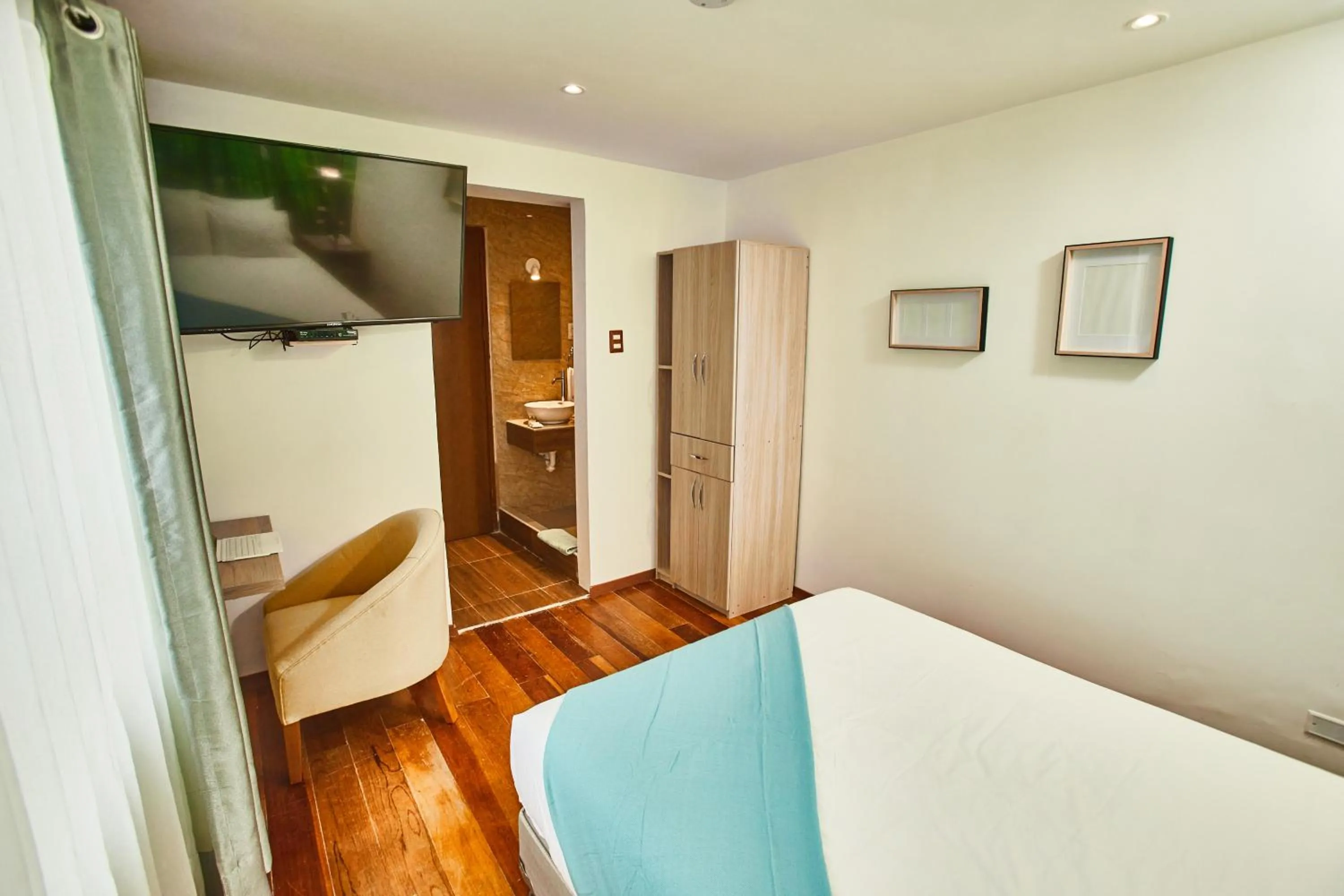 Bed in Inti Tampu Inn