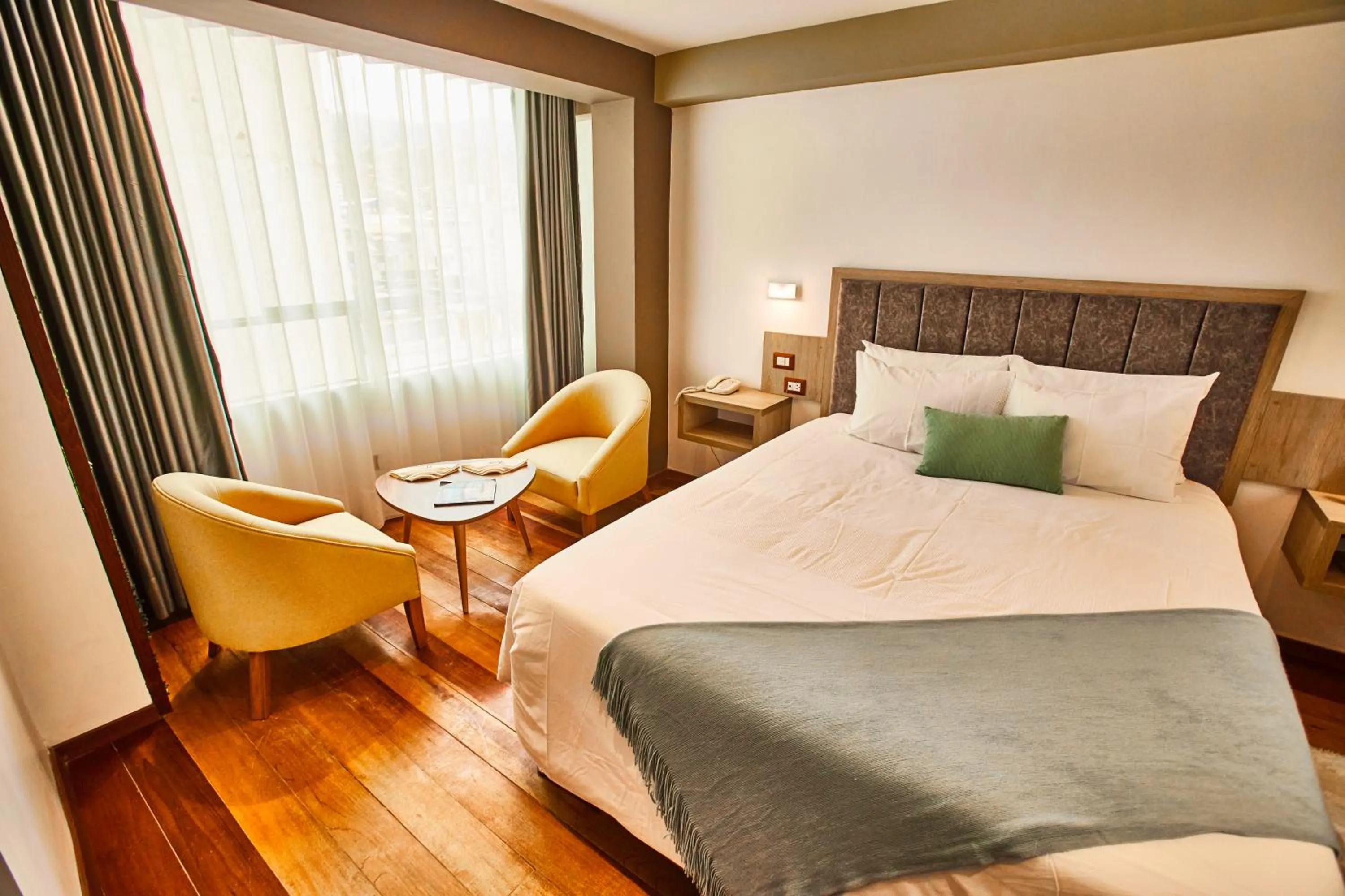 Bed in Inti Tampu Inn