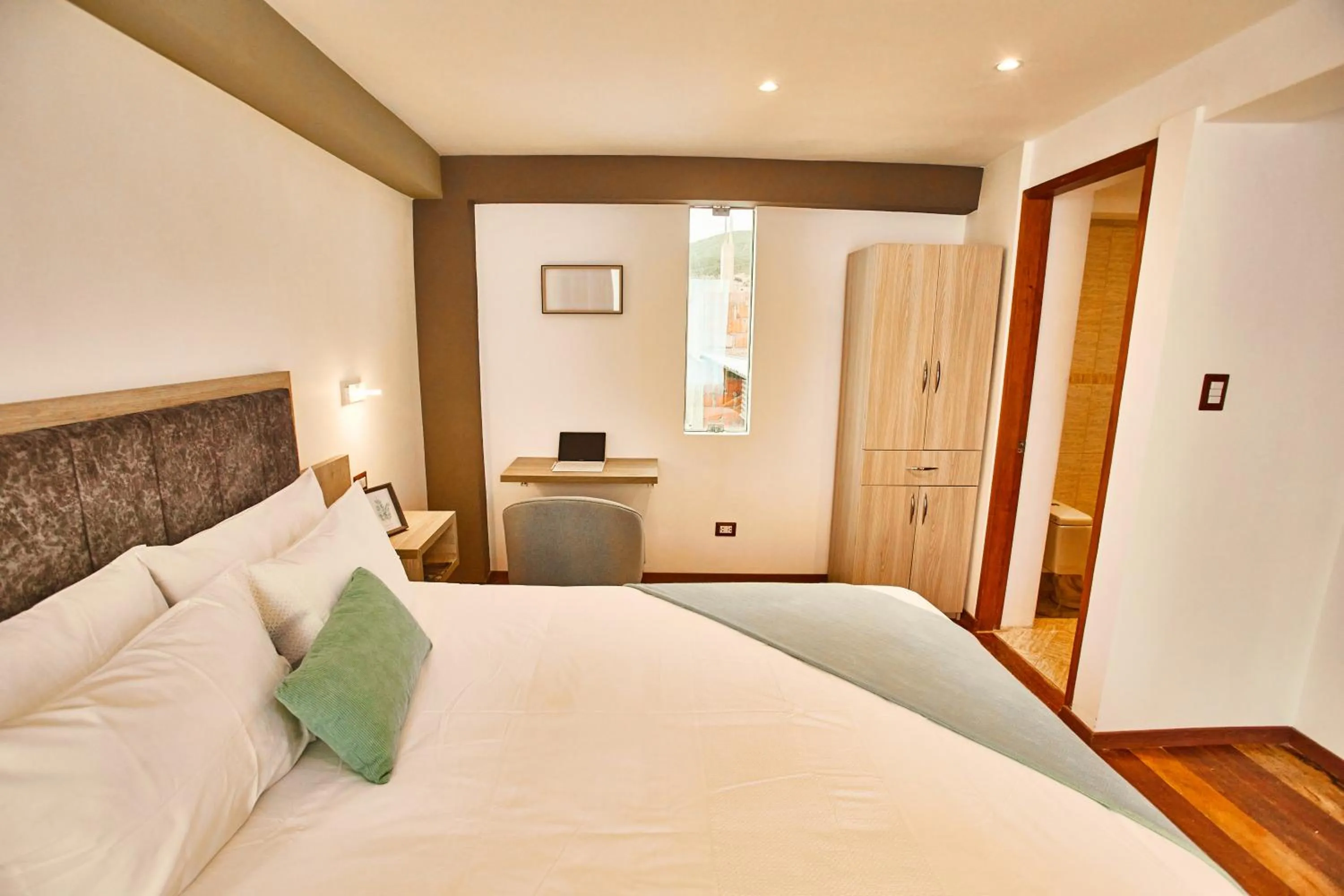 Bed in Inti Tampu Inn